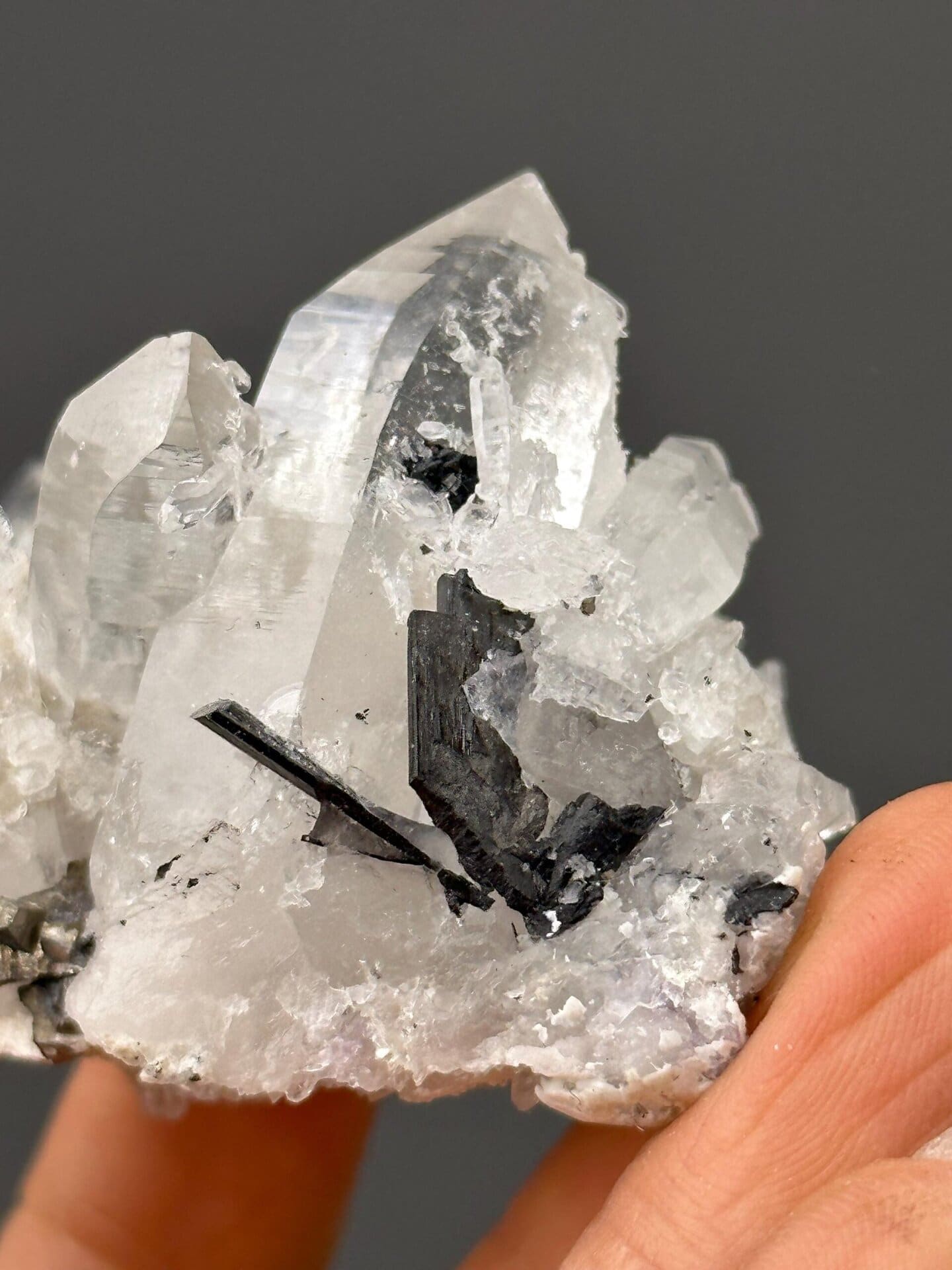 Angled view of quartz cluster showing cassiterite crystals