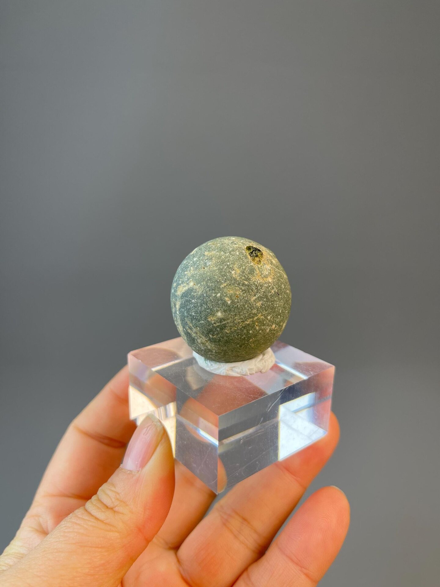 Side view of small prehnite cluster specimen