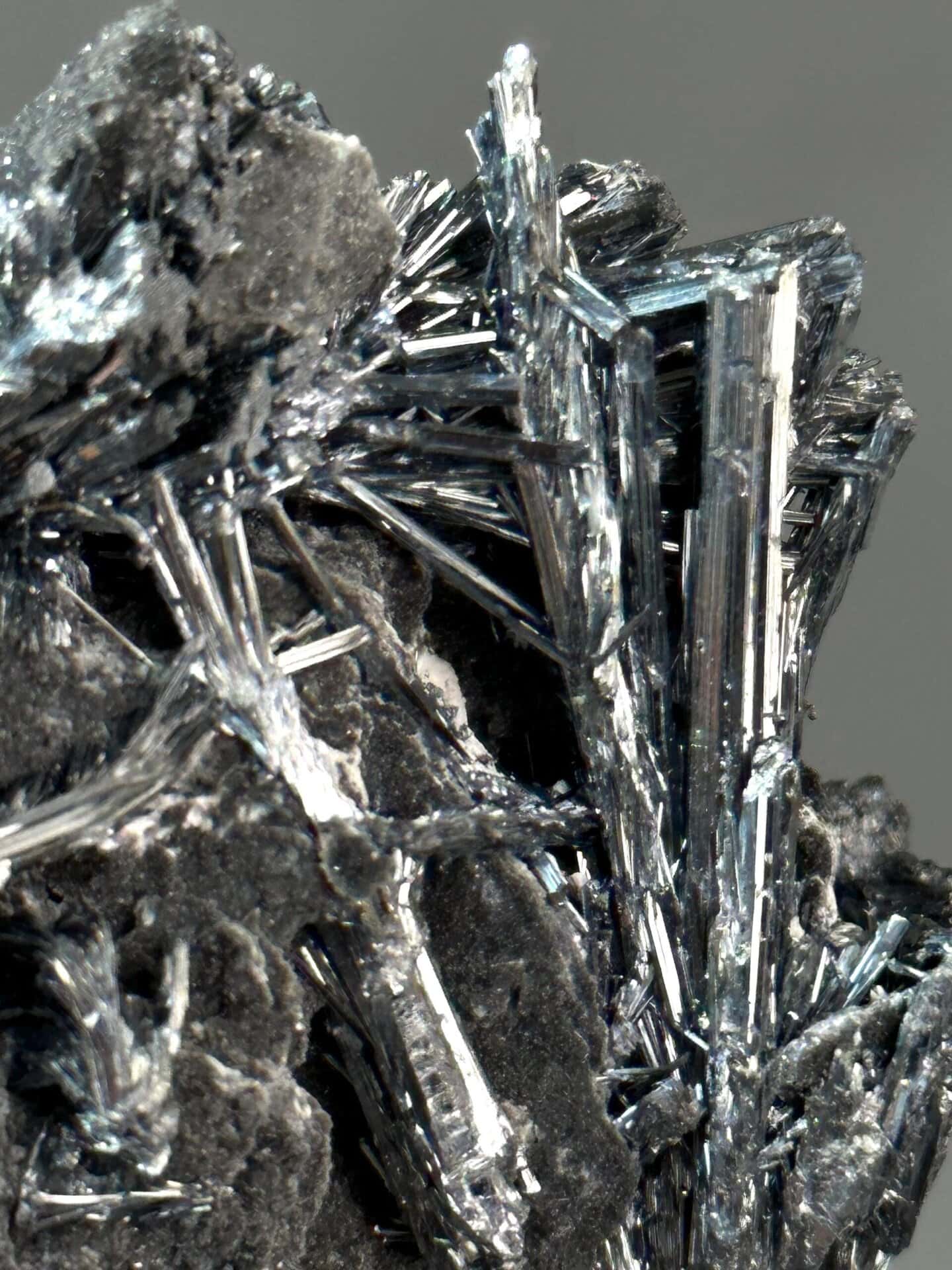 Angled view of metallic stibnite blade cluster