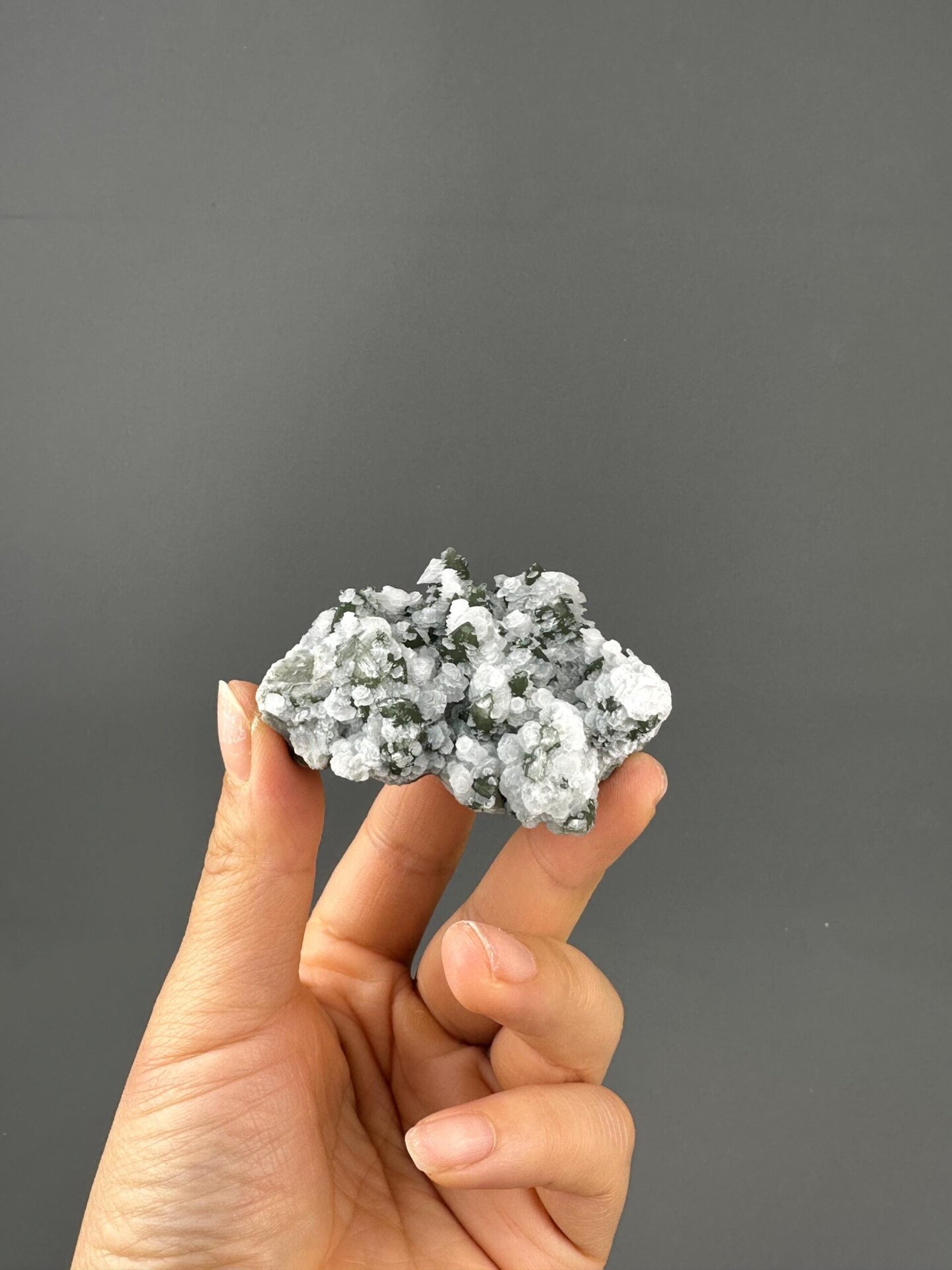 Side view of flower calcite green quartz specimen