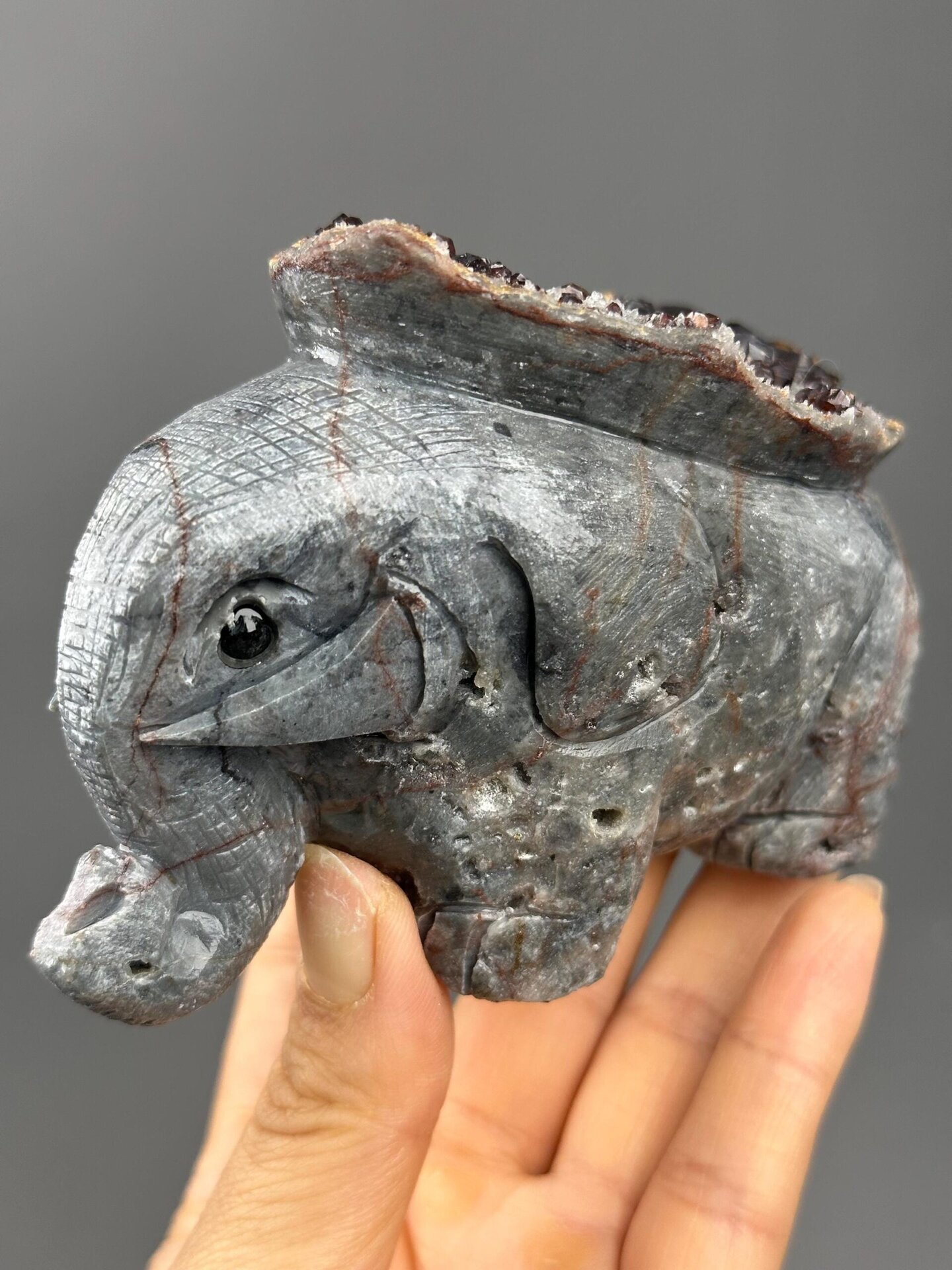 Front view of carved garnet elephant figurine