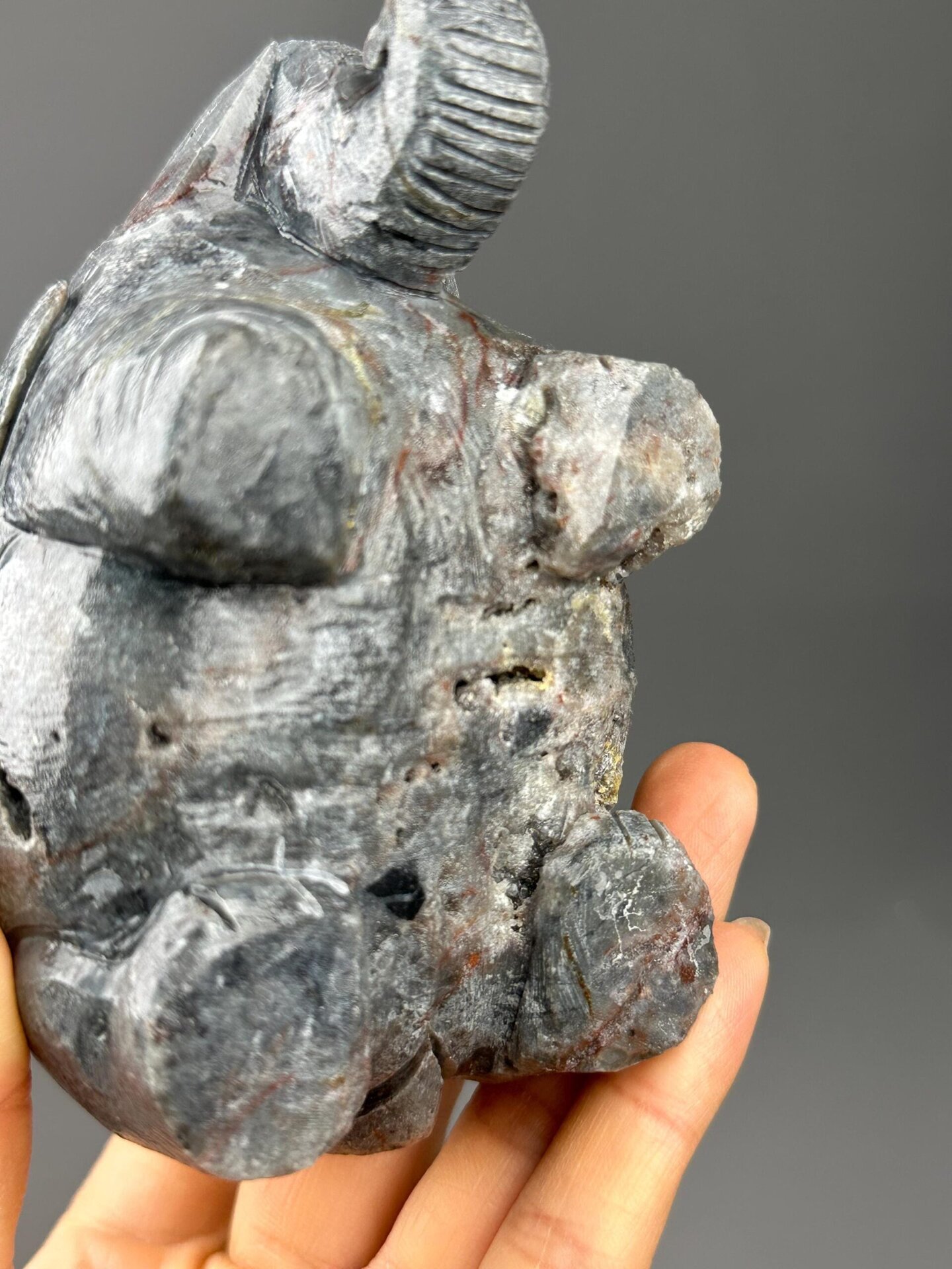 Carved garnet elephant with ruler scale reference