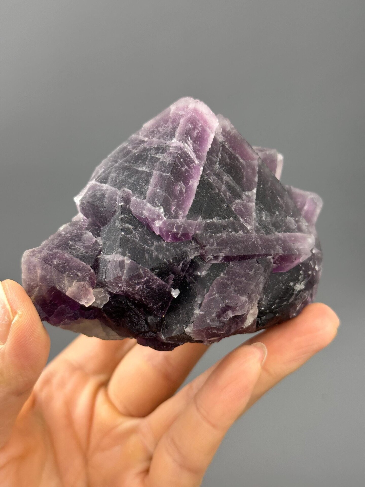 Top view of triangular fluorite showing purple and green