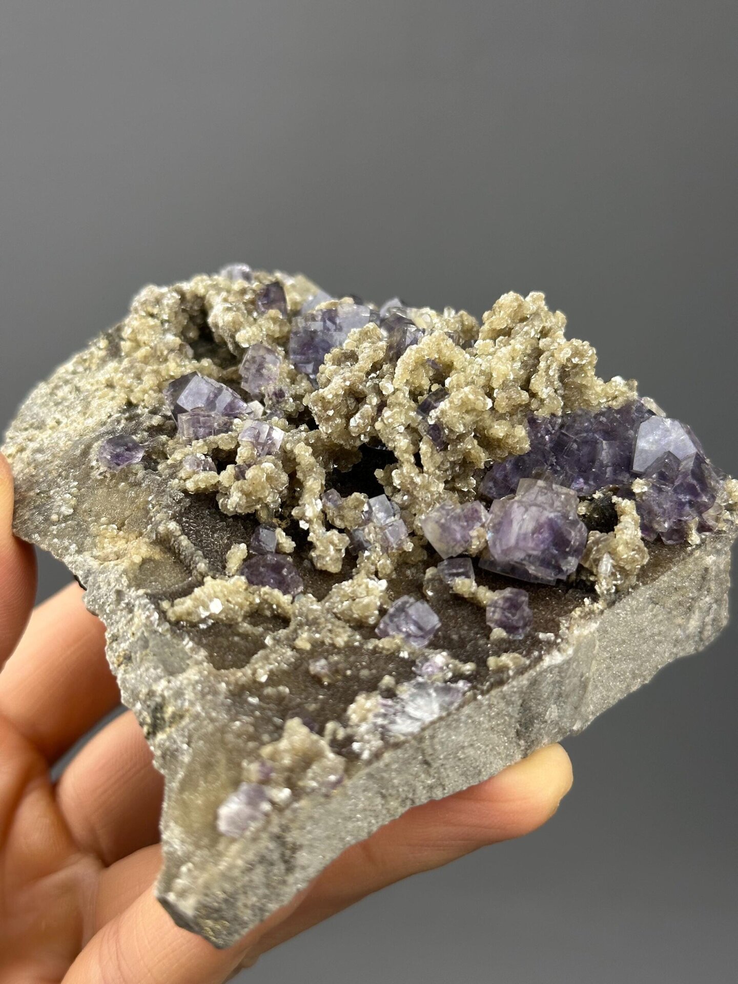Side view of purple phantom fluorite on matrix