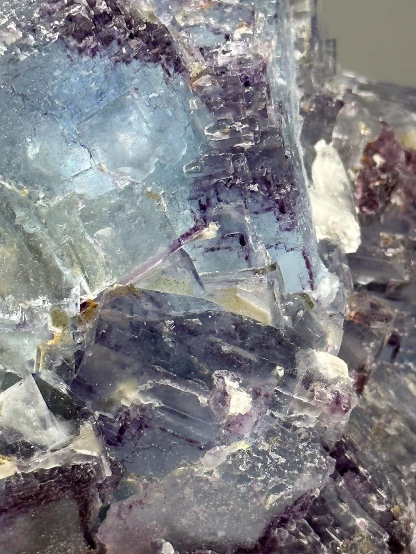 Angled view of large purple-blue etched fluorite twin