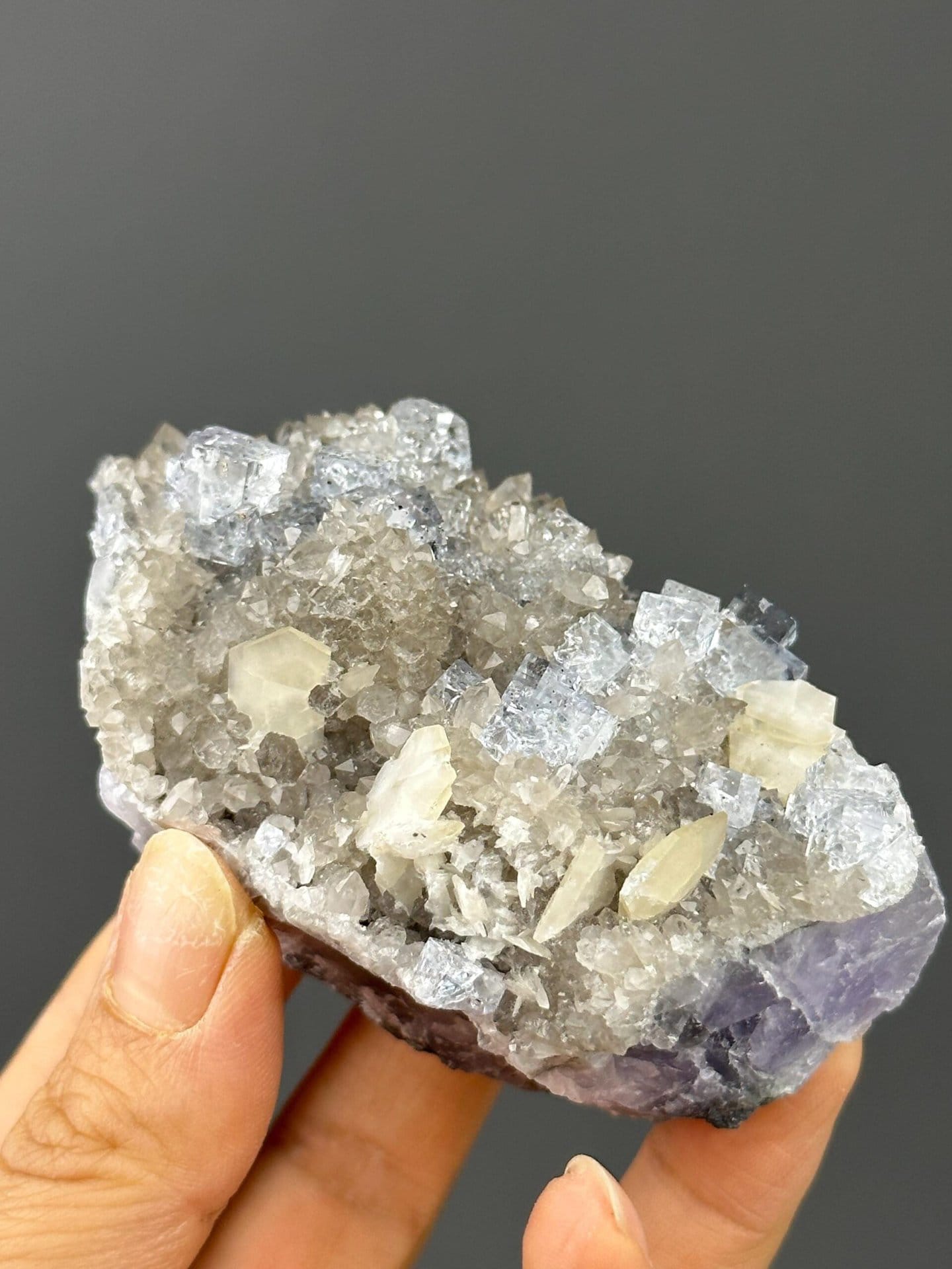 Vivid sky-blue coloration on fluorite crystal faces