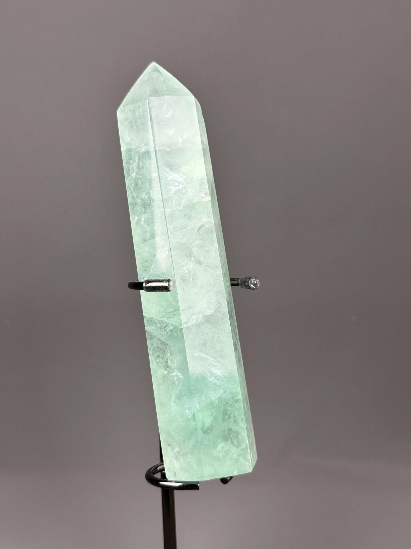 Polished green fluorite tower standing upright