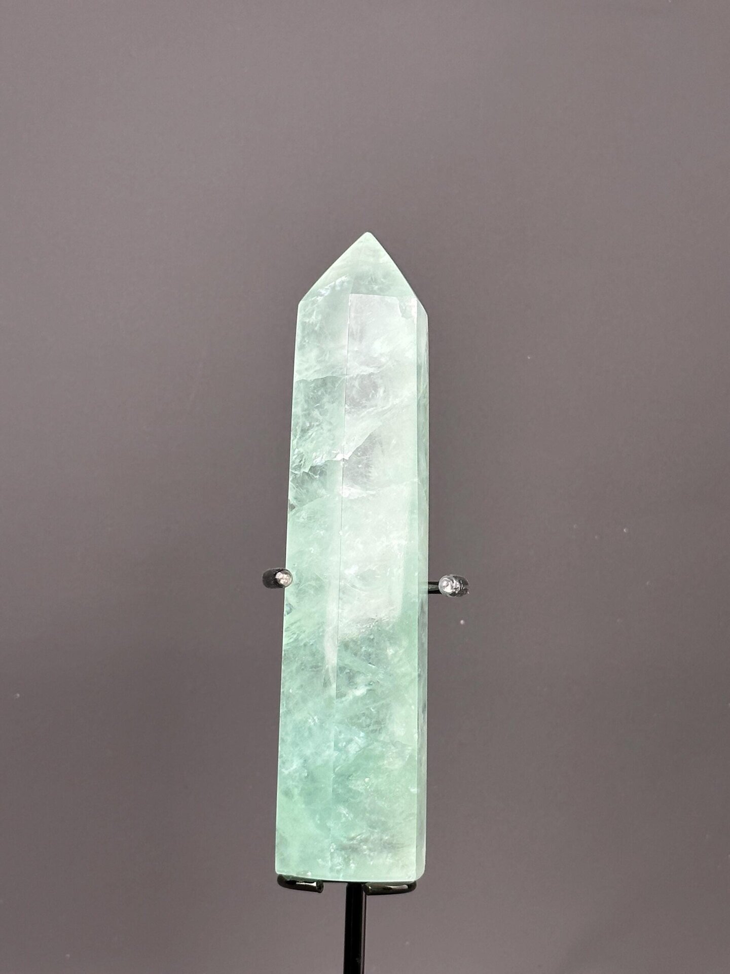 Base of polished green fluorite tower specimen