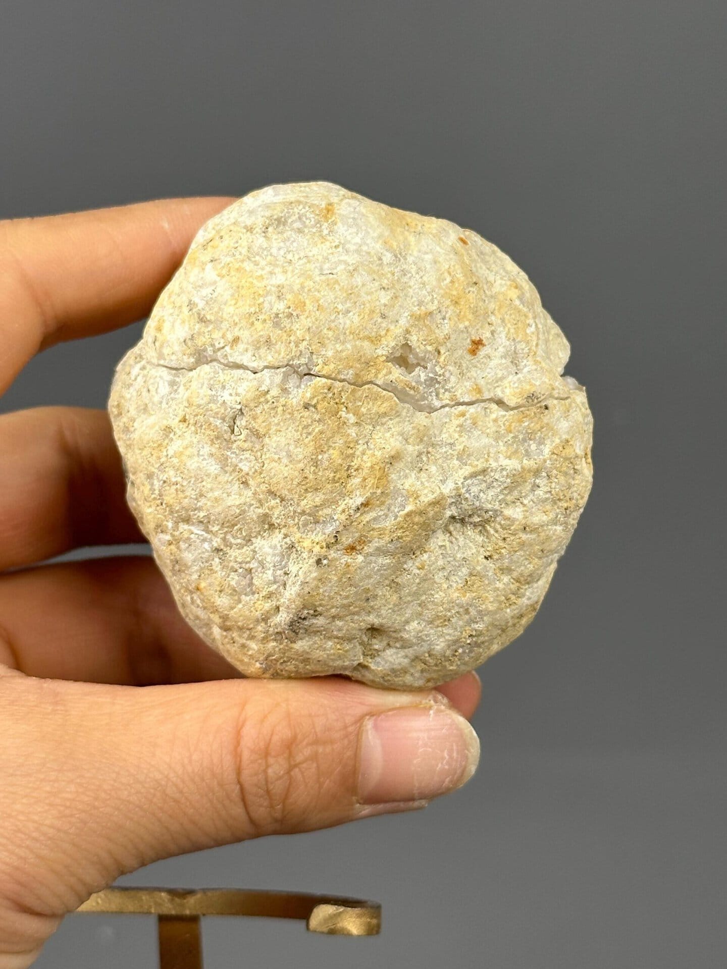 Gold base mount detail beneath quartz geode