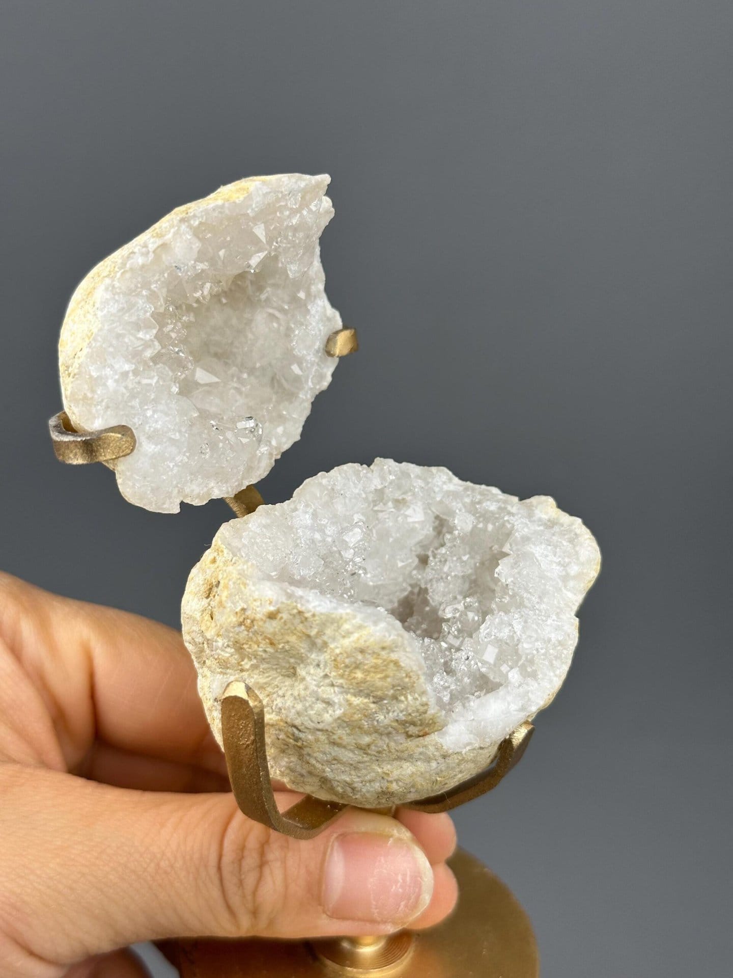 Quartz geode on gold base with ruler scale reference