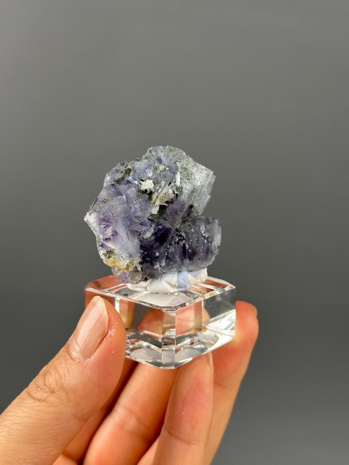 Green hue phantom zoning inside purple fluorite