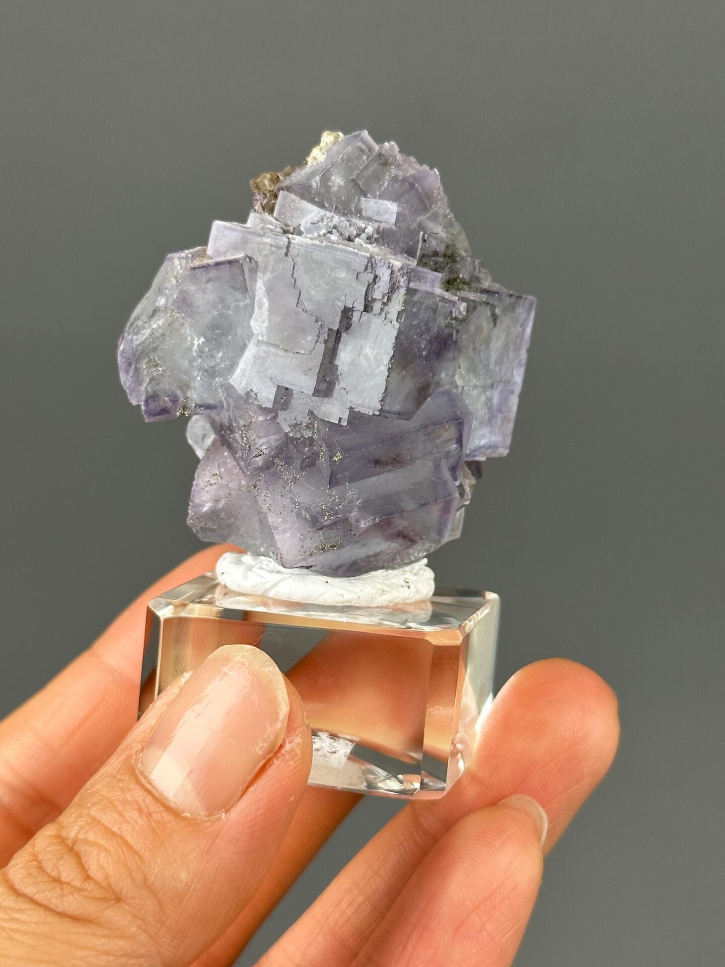 Full deep purple fluorite twin specimen on white background