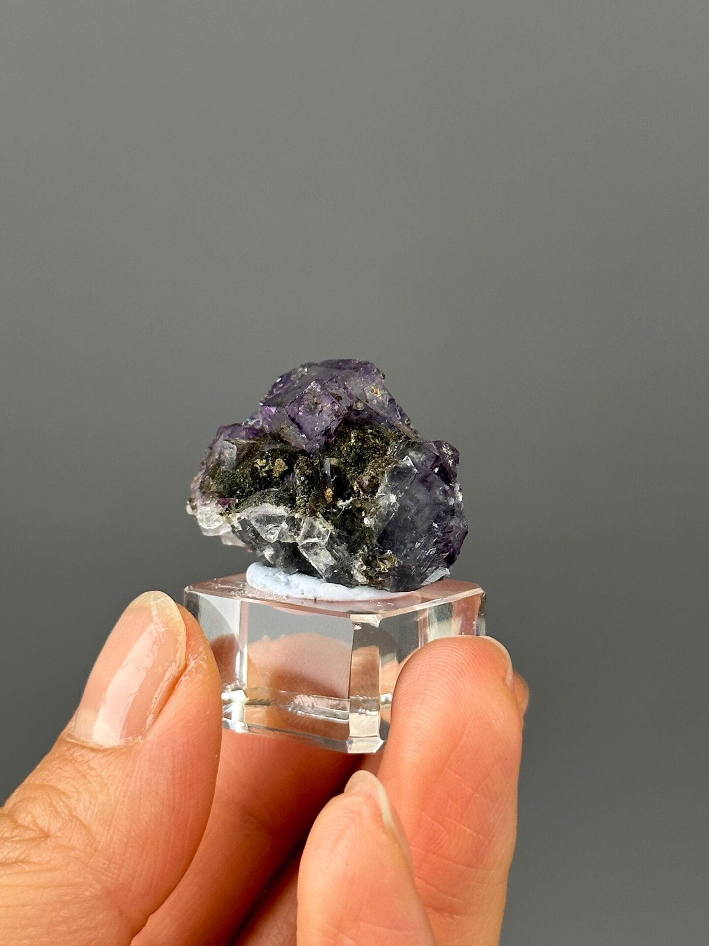 Purple fluorite with green epidote inclusion detail