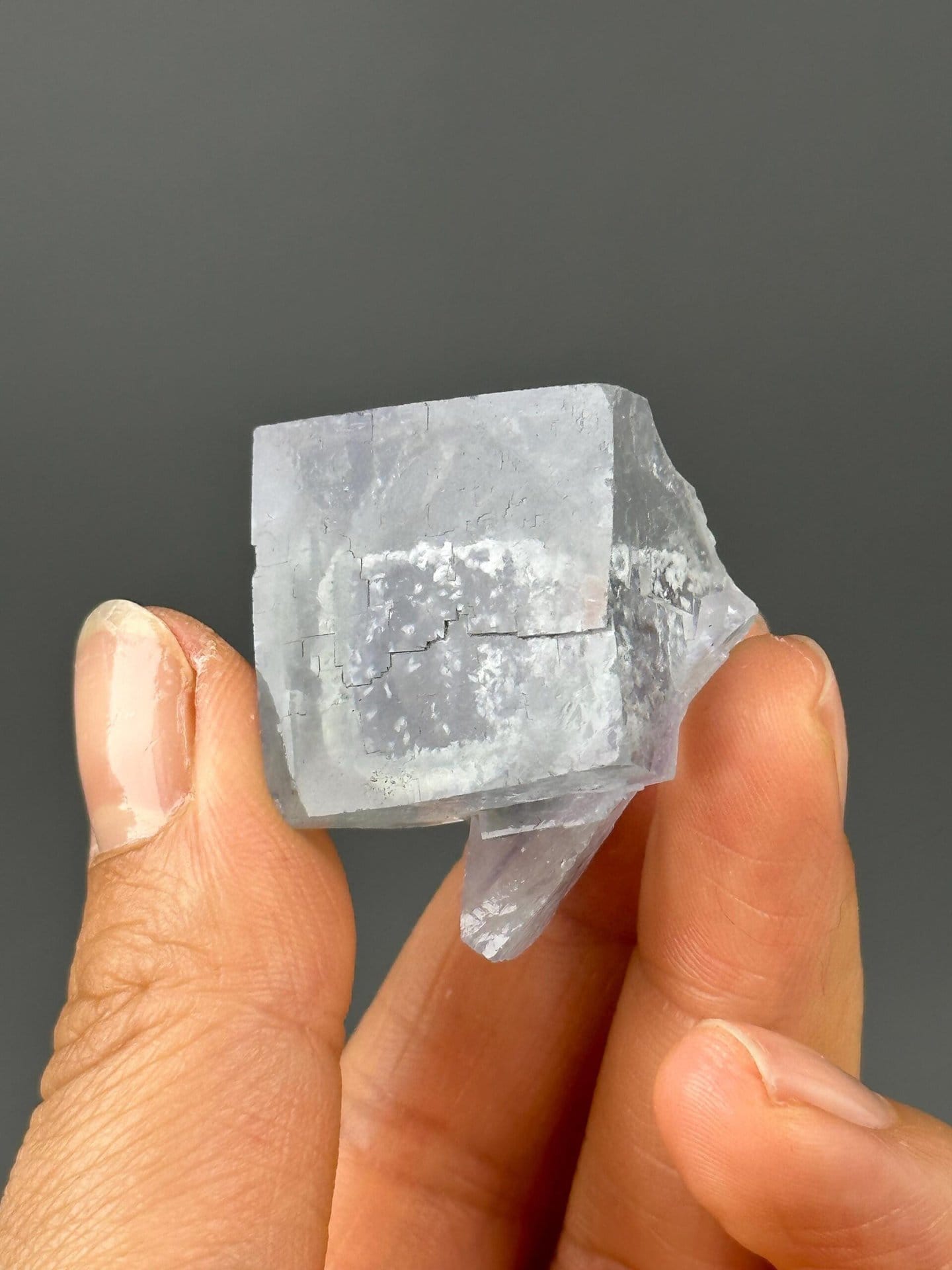 Full light blue twin fluorite specimen on white background