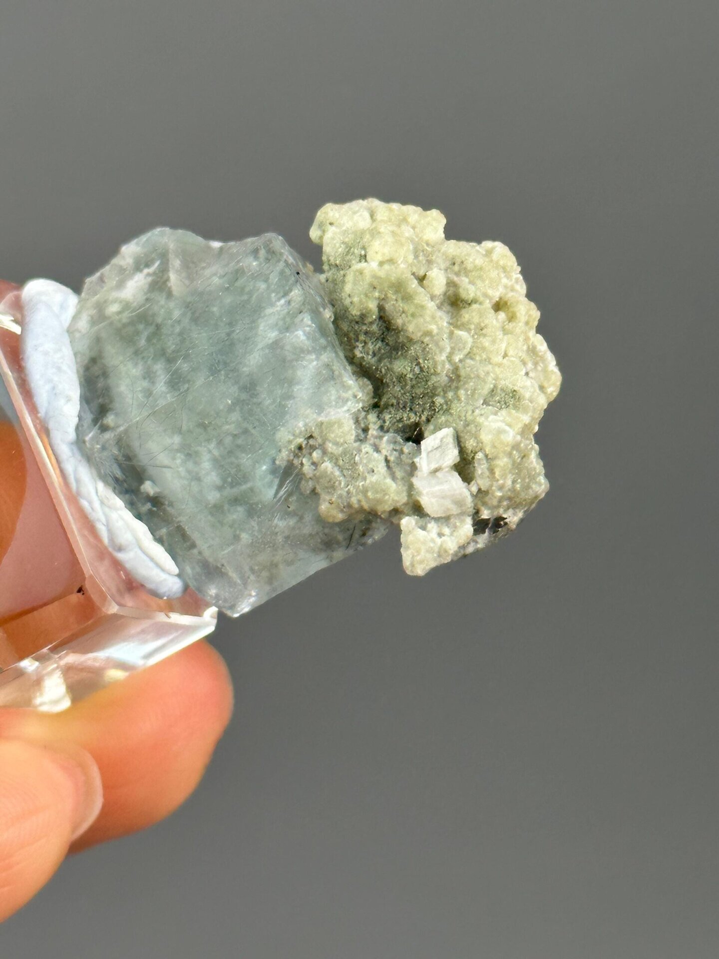 Full green fluorite dolomite specimen on white background