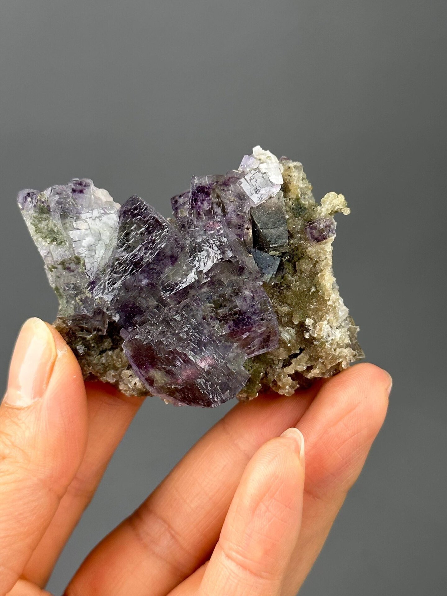 Front view of deep purple fluorite with white dolomite from YGX