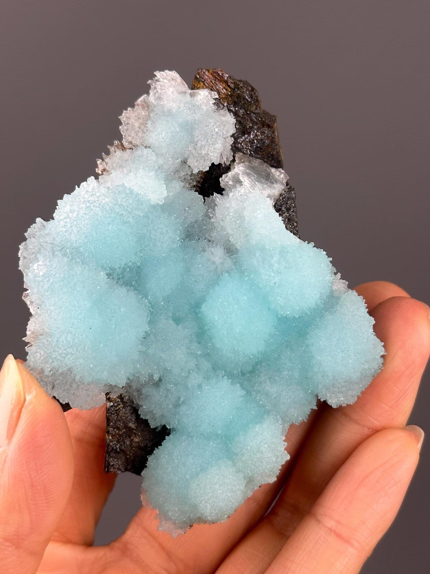 Vitreous luster on blue aragonite crystal surfaces