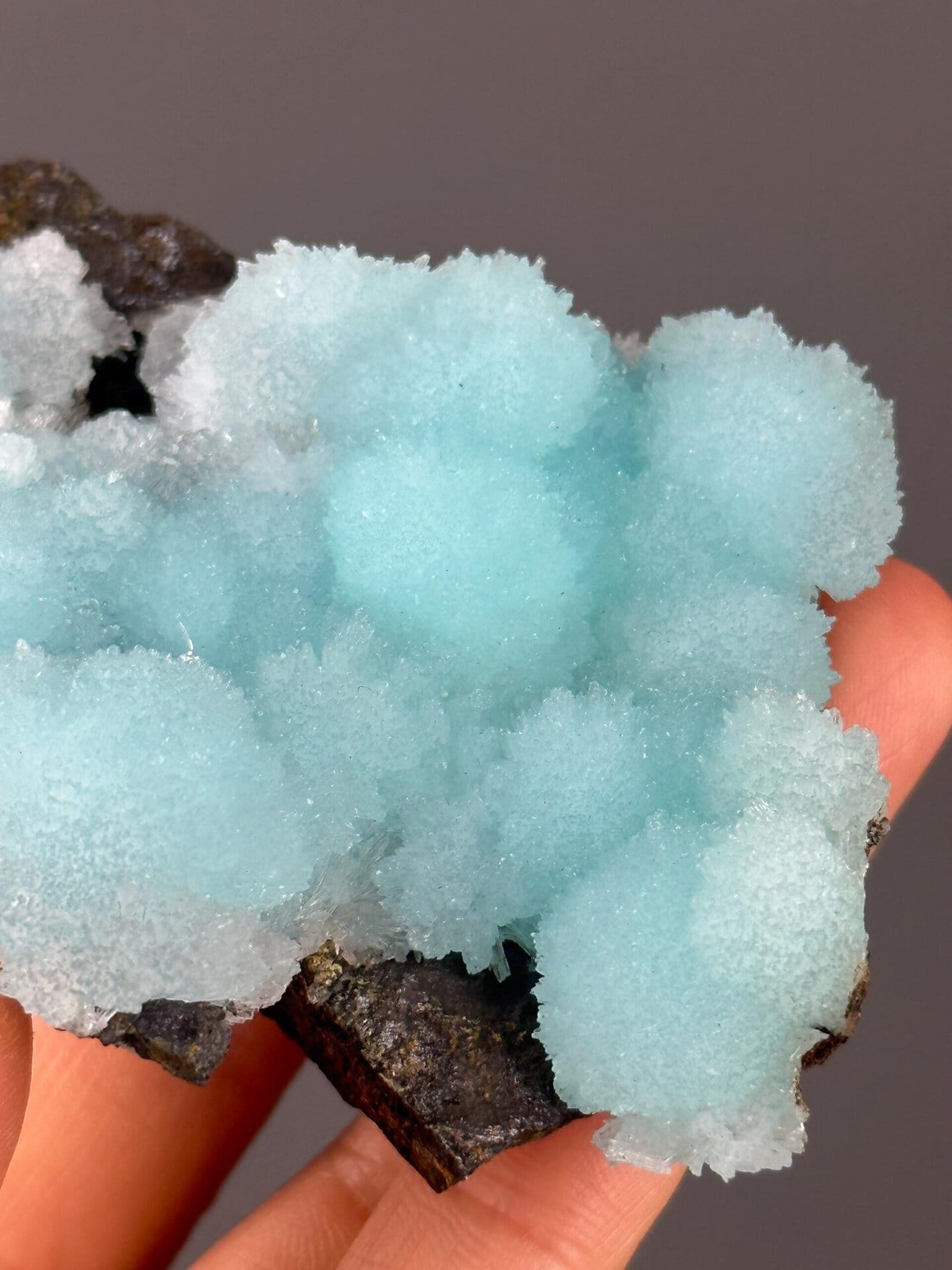 Back view of blue aragonite cluster base