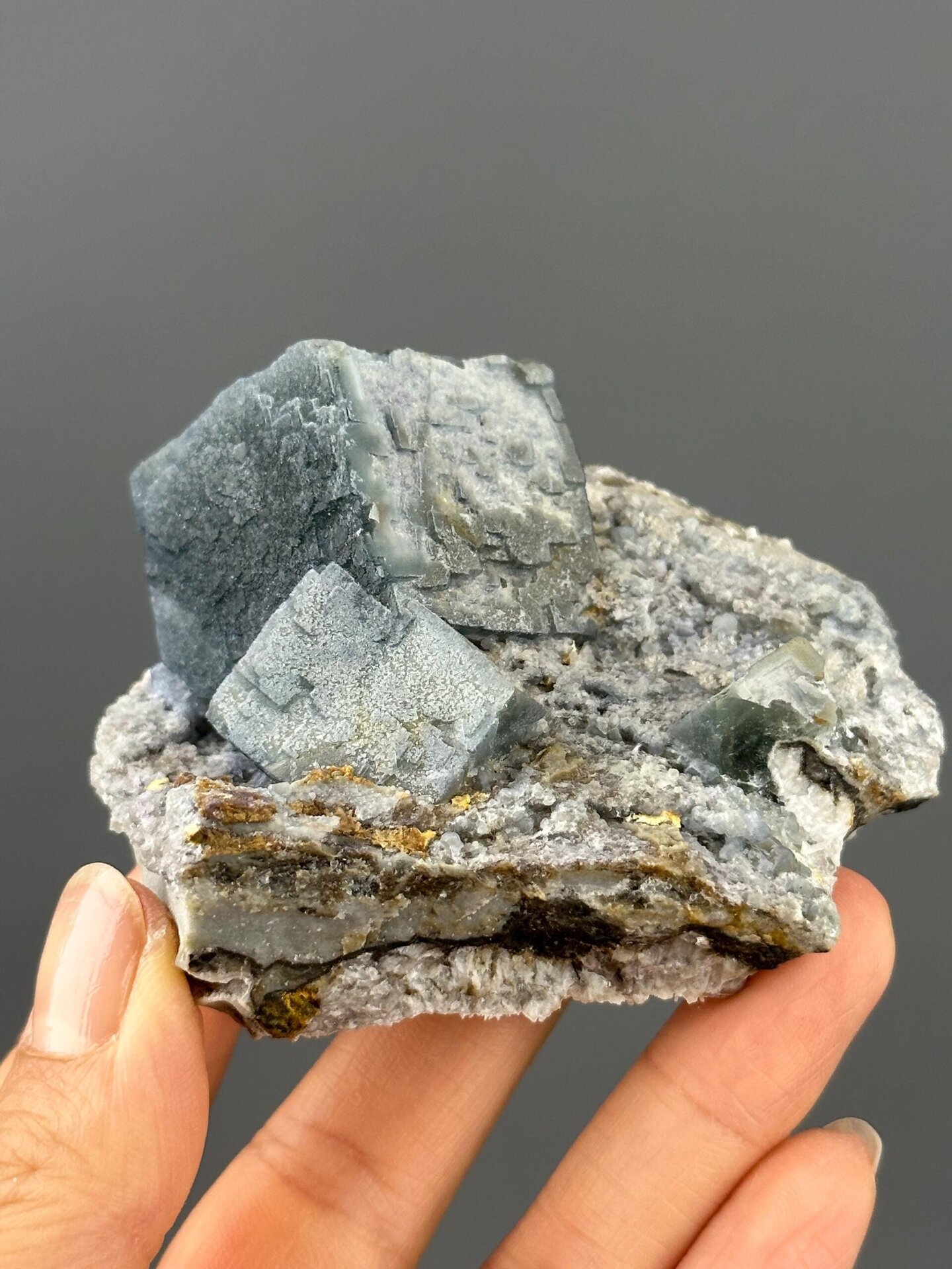 Terraced step growth fluorite crystal faces close-up