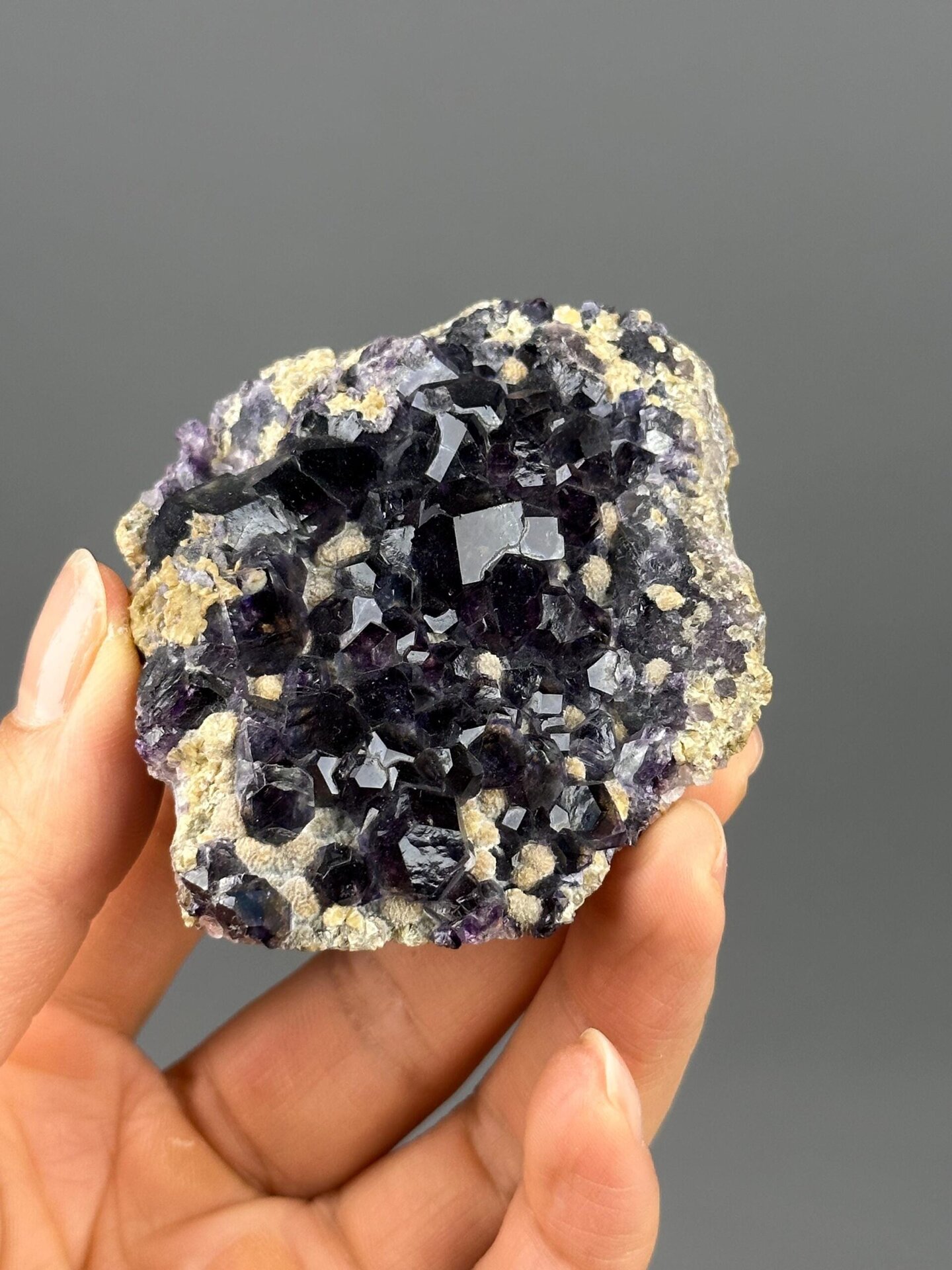 Dense cubic purple fluorite crystals close-up