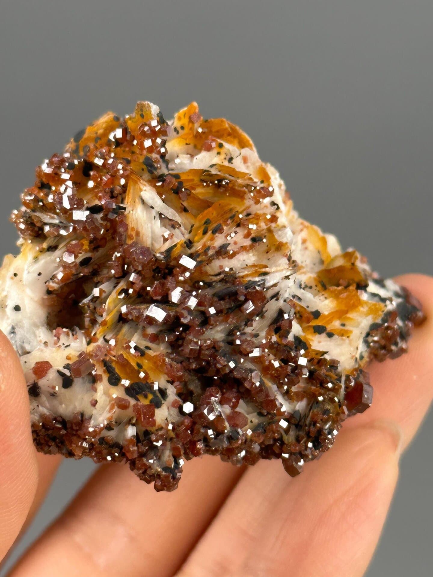 Vibrant red vanadinite under studio lighting