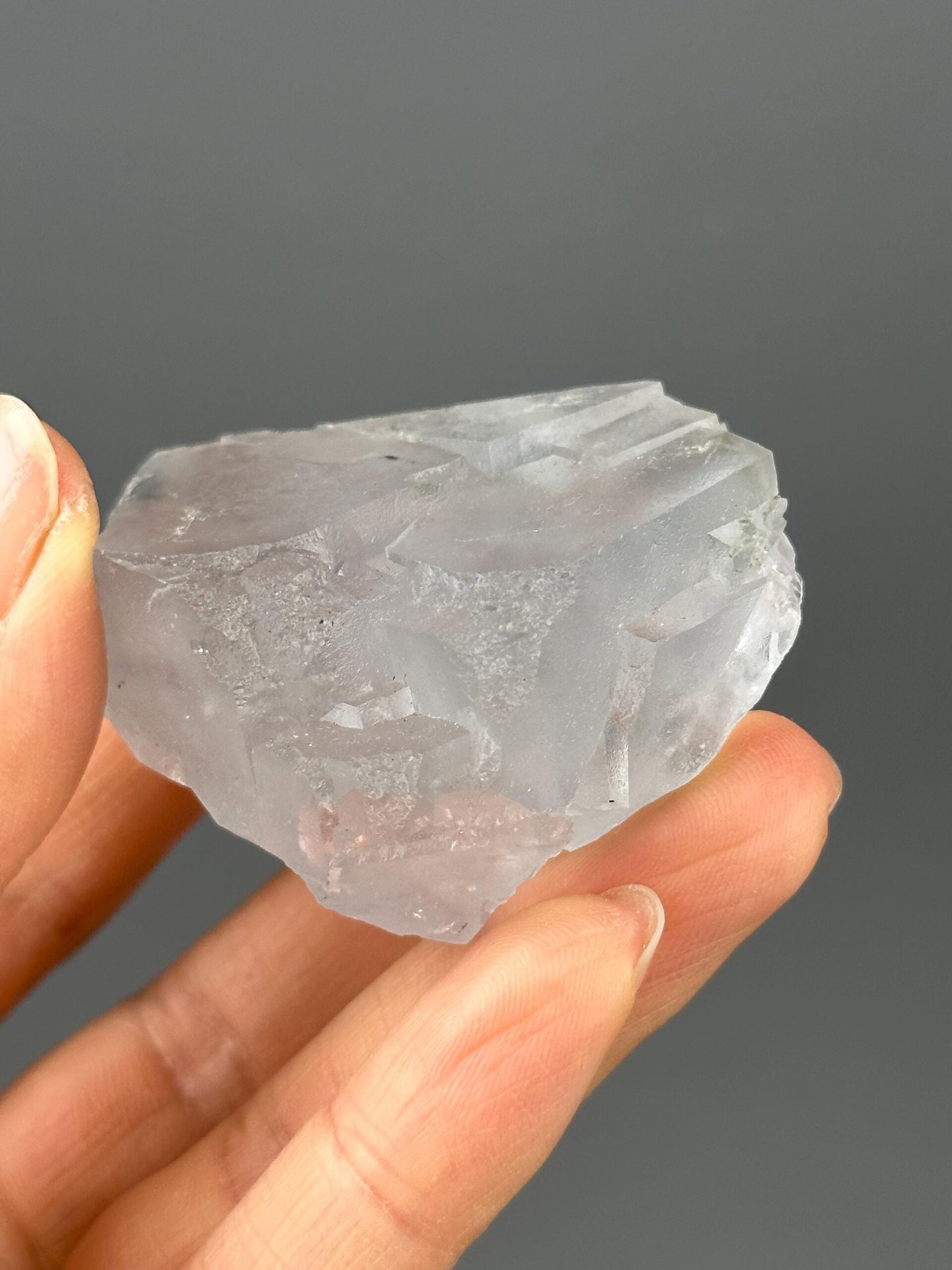 Hunan white fluorite with blue phantom under studio lighting