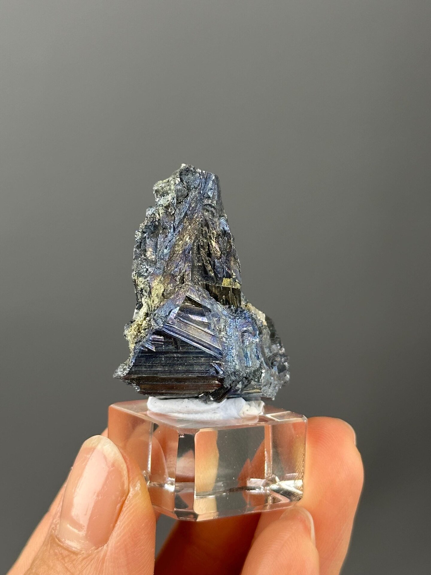 Lustrous metallic stibnite surface close-up