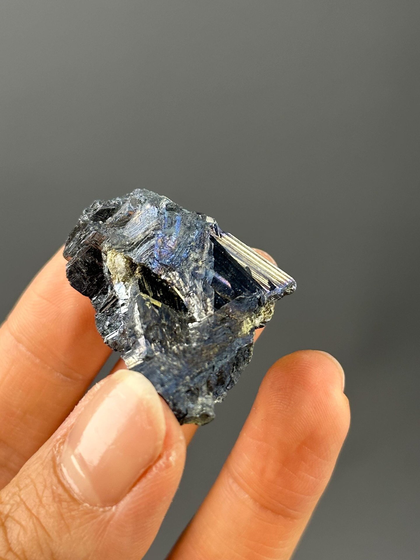 Full stibnite specimen on white background
