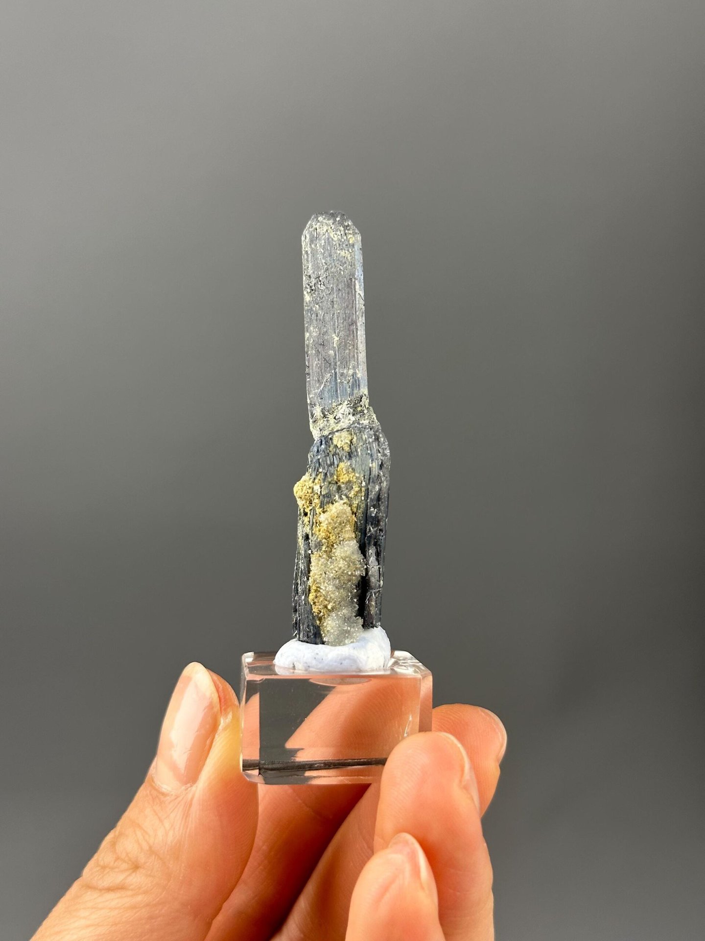 Glossy metallic stibnite crystal blades close-up