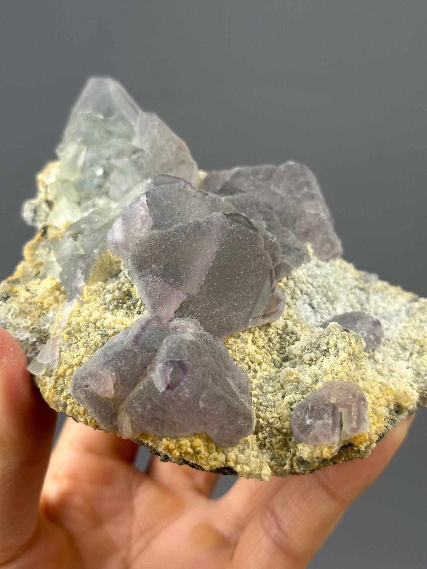 Large purple fluorite cluster on rock base, Guizhou, China