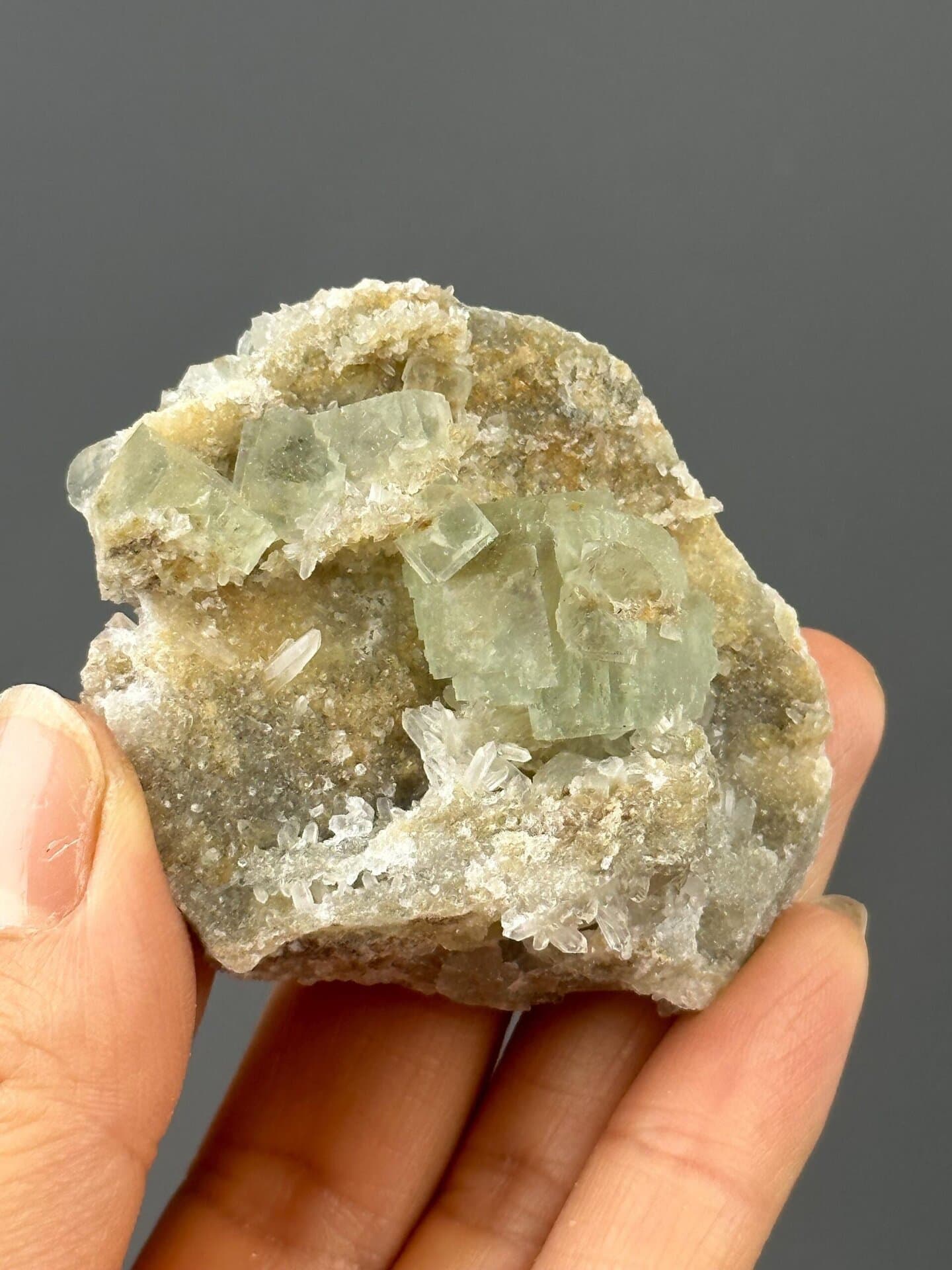 Close-up of green fluorite on quartz matrix