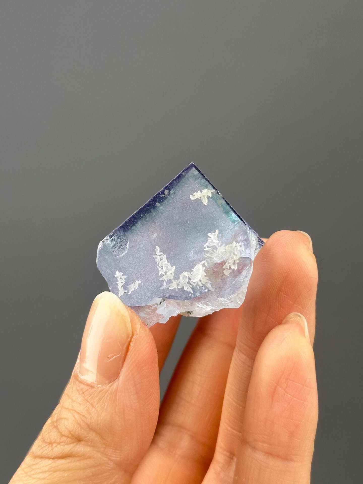 Close-up of petal-like calcite formations on fluorite