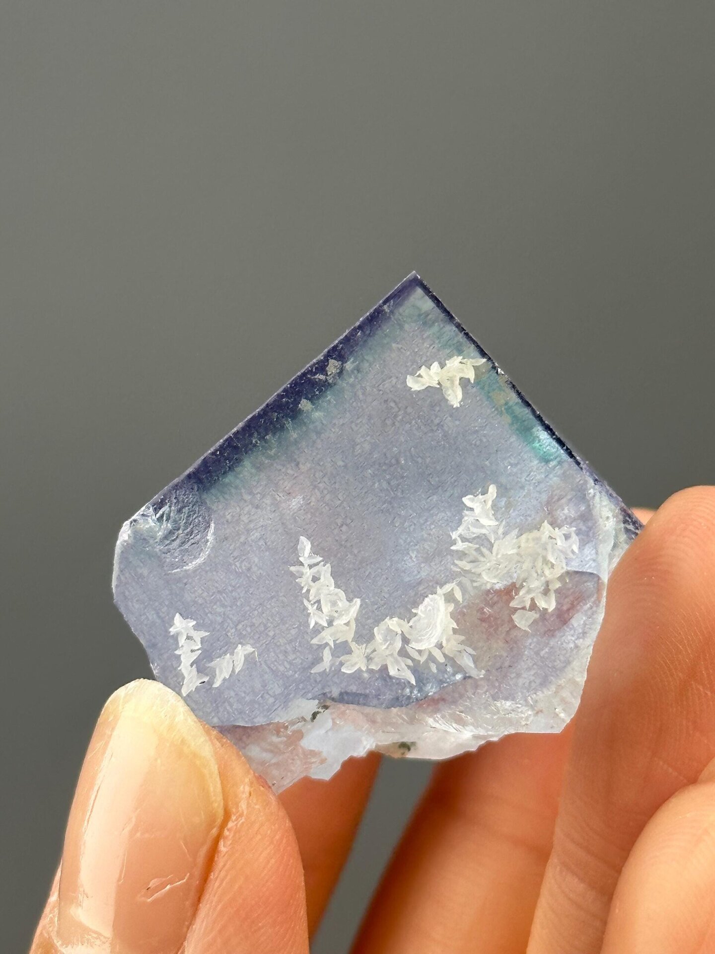Top view of blue-purple fluorite with calcite petals