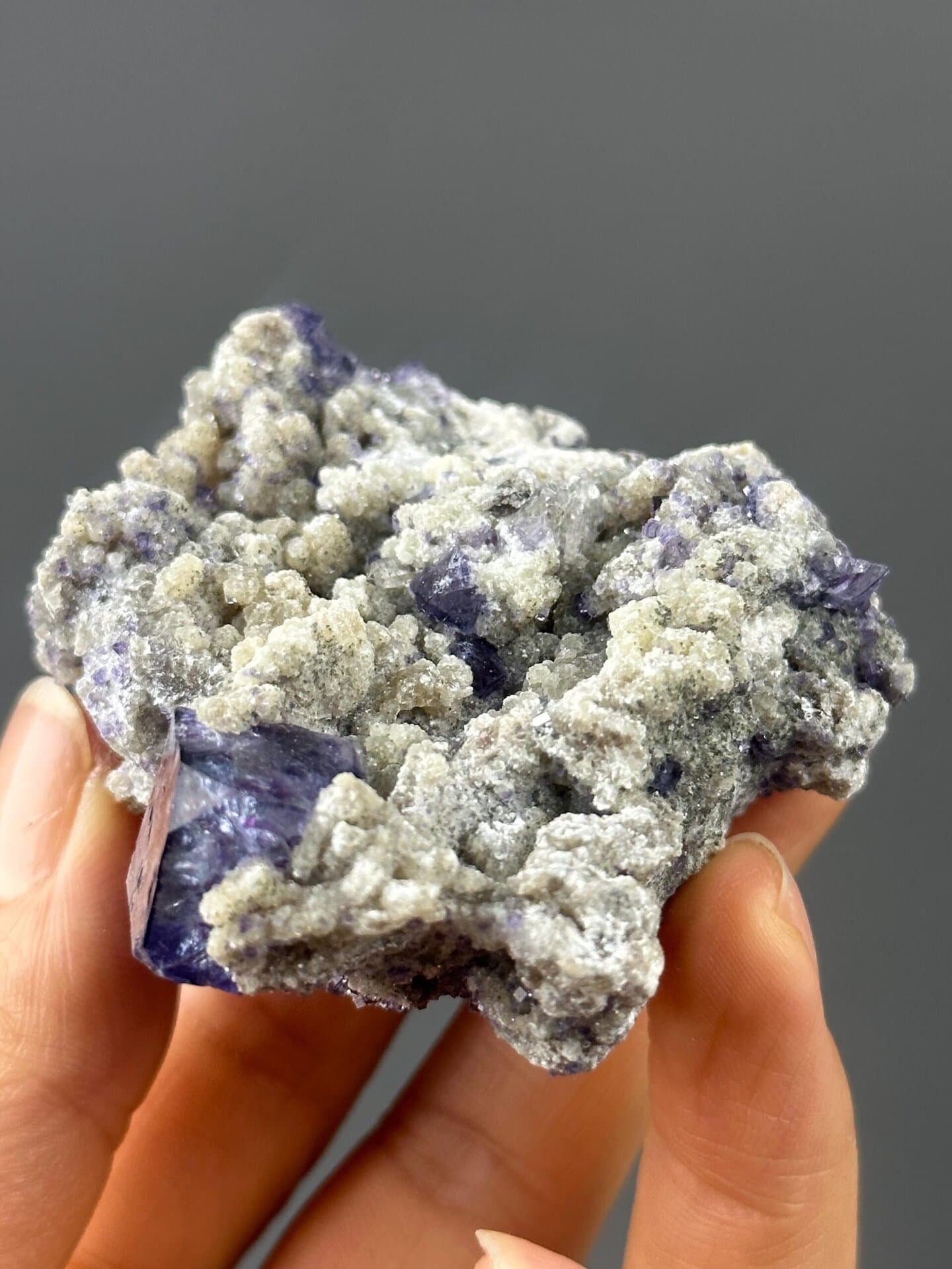 Front view of large purple phantom fluorite cluster, 3×2.5×1.1 in