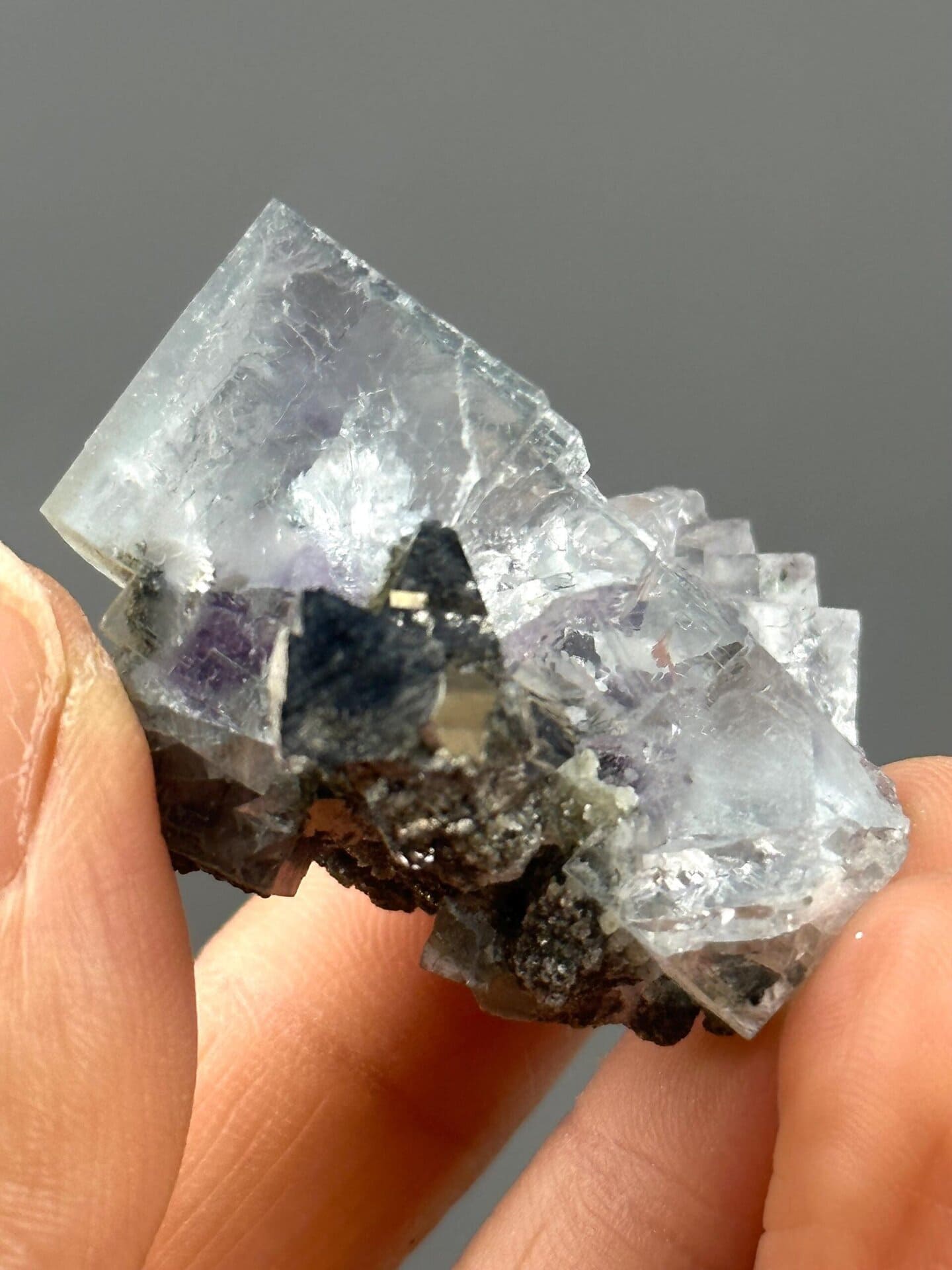 Fluorescent purple fluorite with golden pyrite accents from China