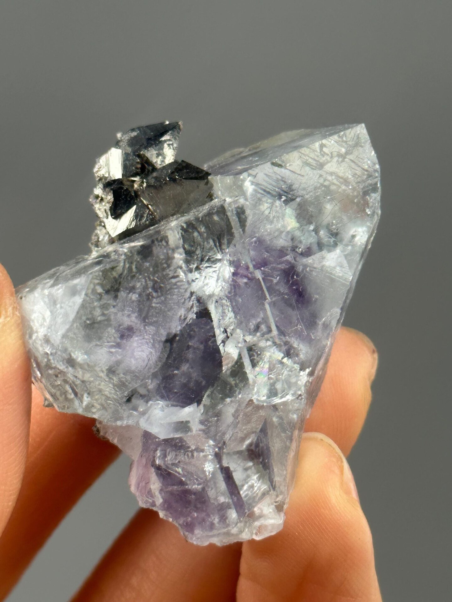 Back view of fluorescent purple fluorite with pyrite