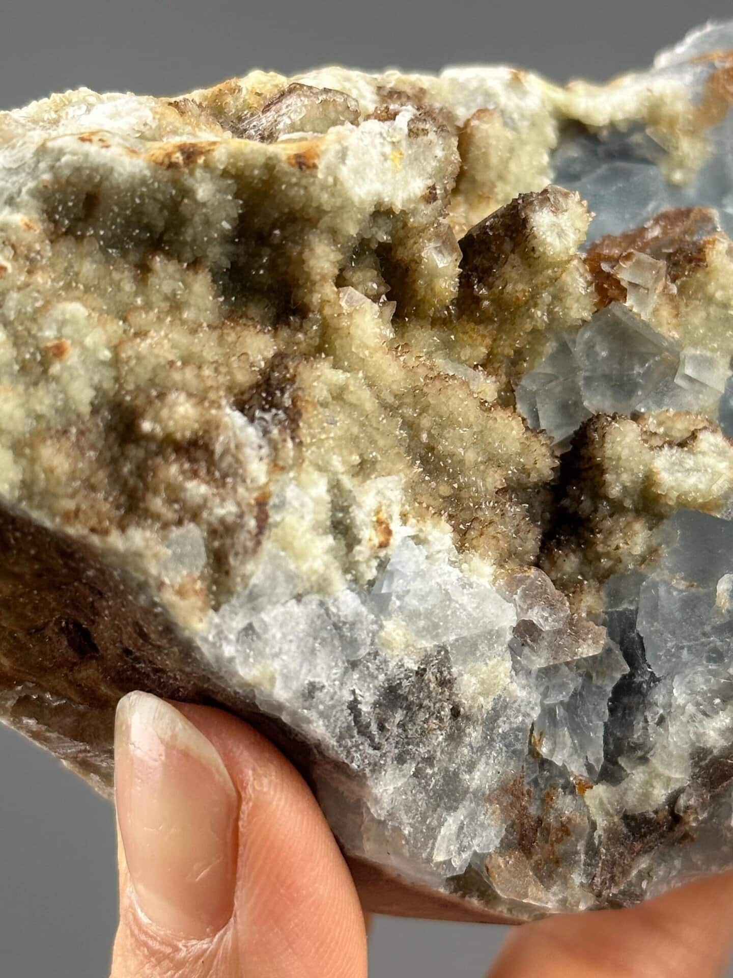Close-up of blue fluorite crystals showing vitreous luster