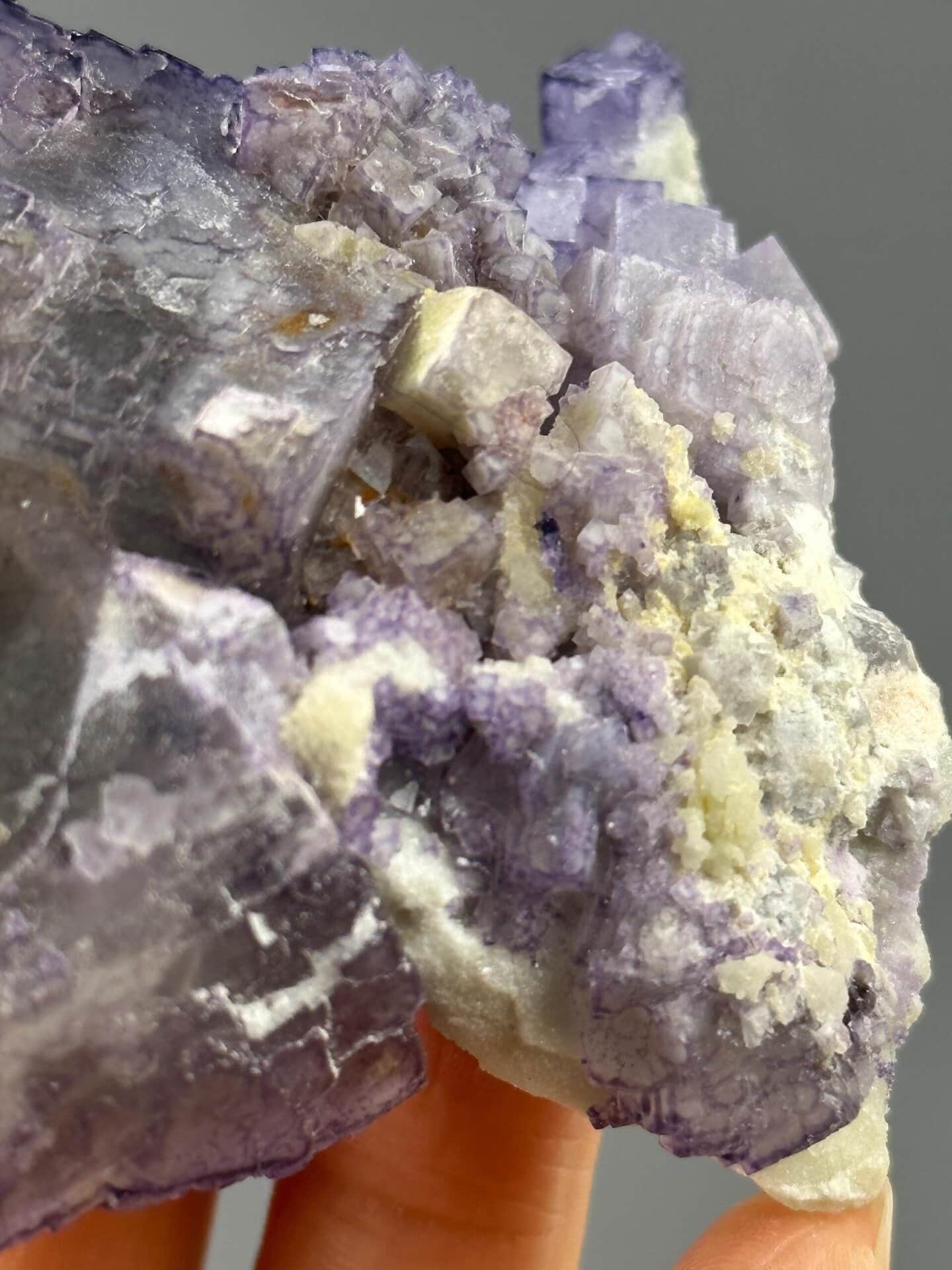Close-up of purple fluorite crystals showing QR code effect