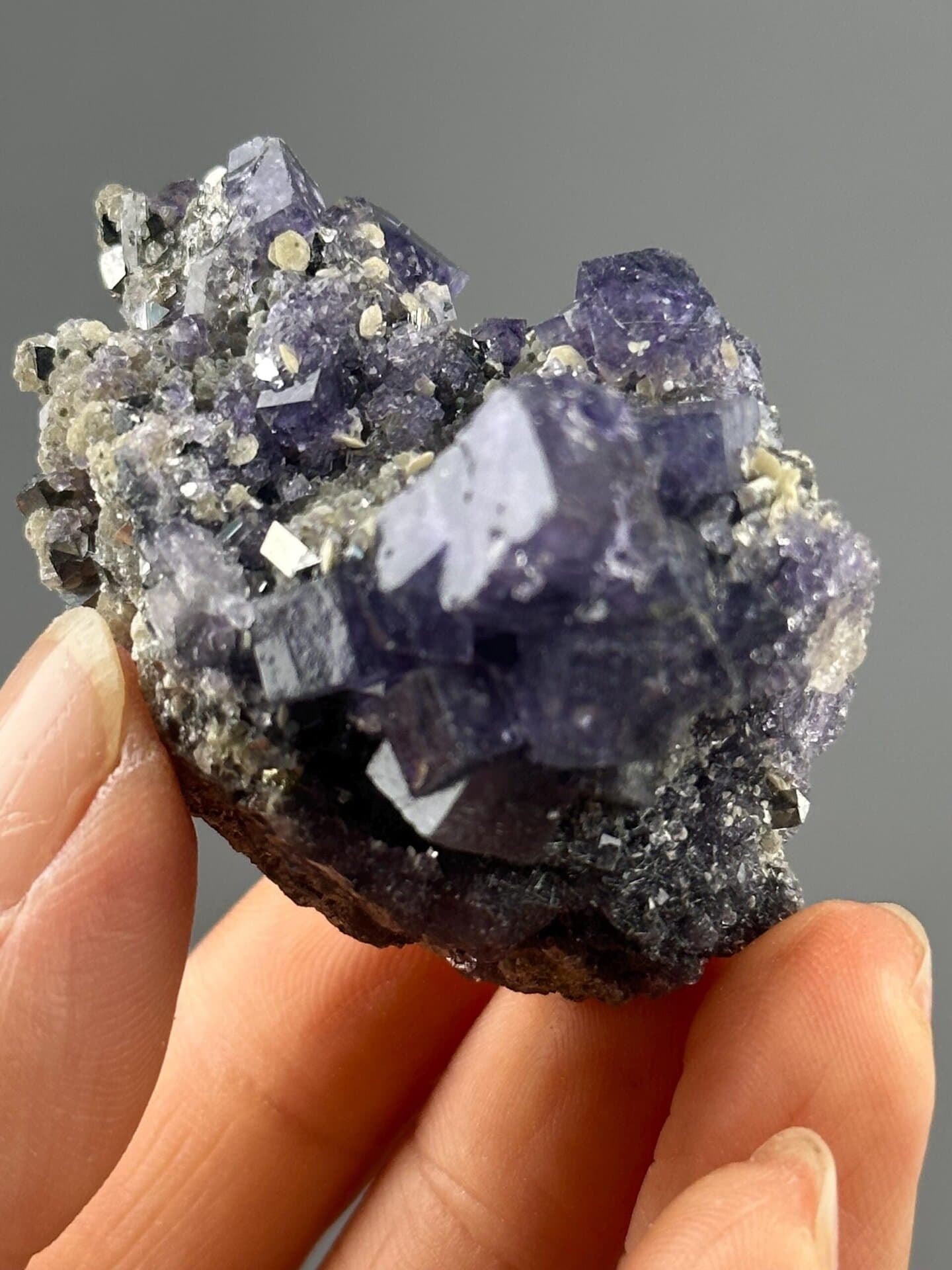 Close-up of phantom zoning in purple fluorite crystal