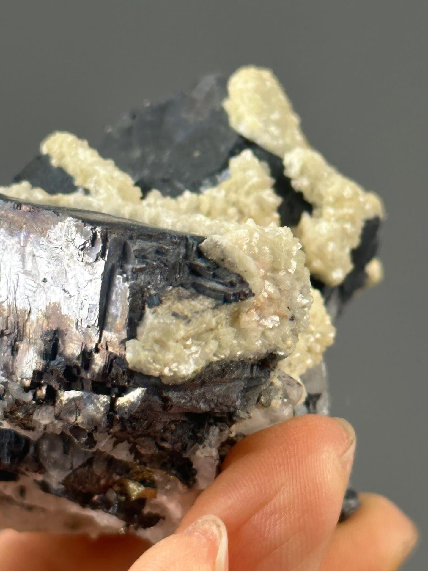 Black iron ore cluster with calcite inclusions, Hunan, China