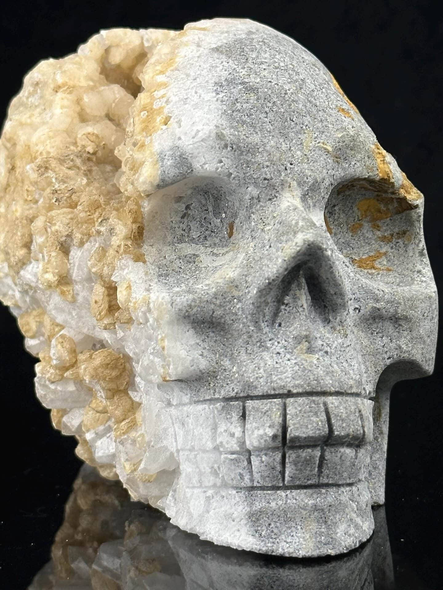 Extra-large hand-carved quartz geode skull with druzy crystal interior