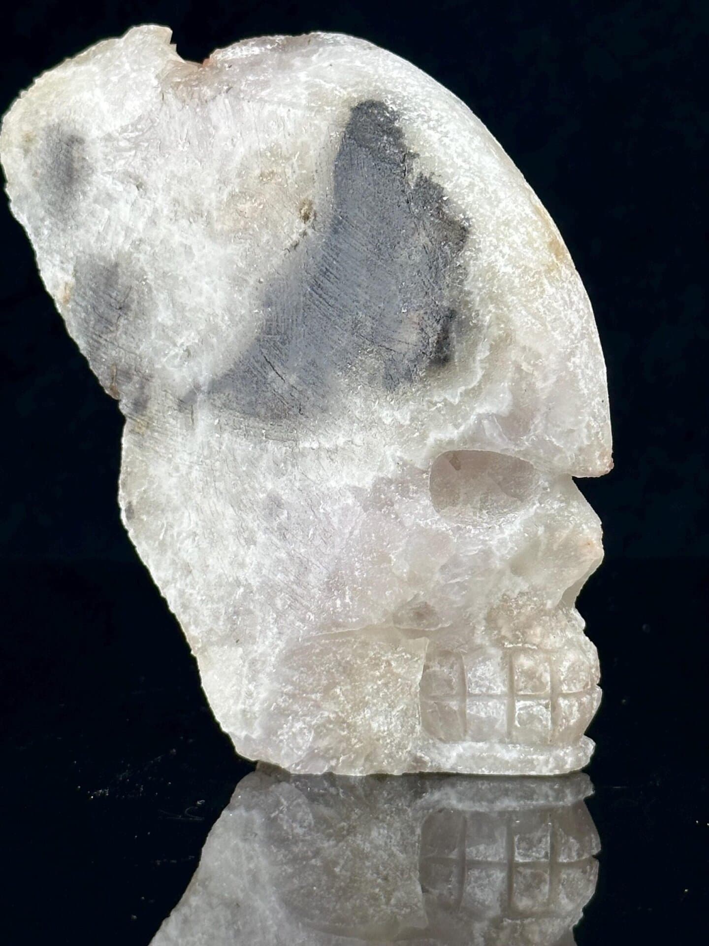 Hand-carved quartz geode skull with sparkling druzy crystal interior