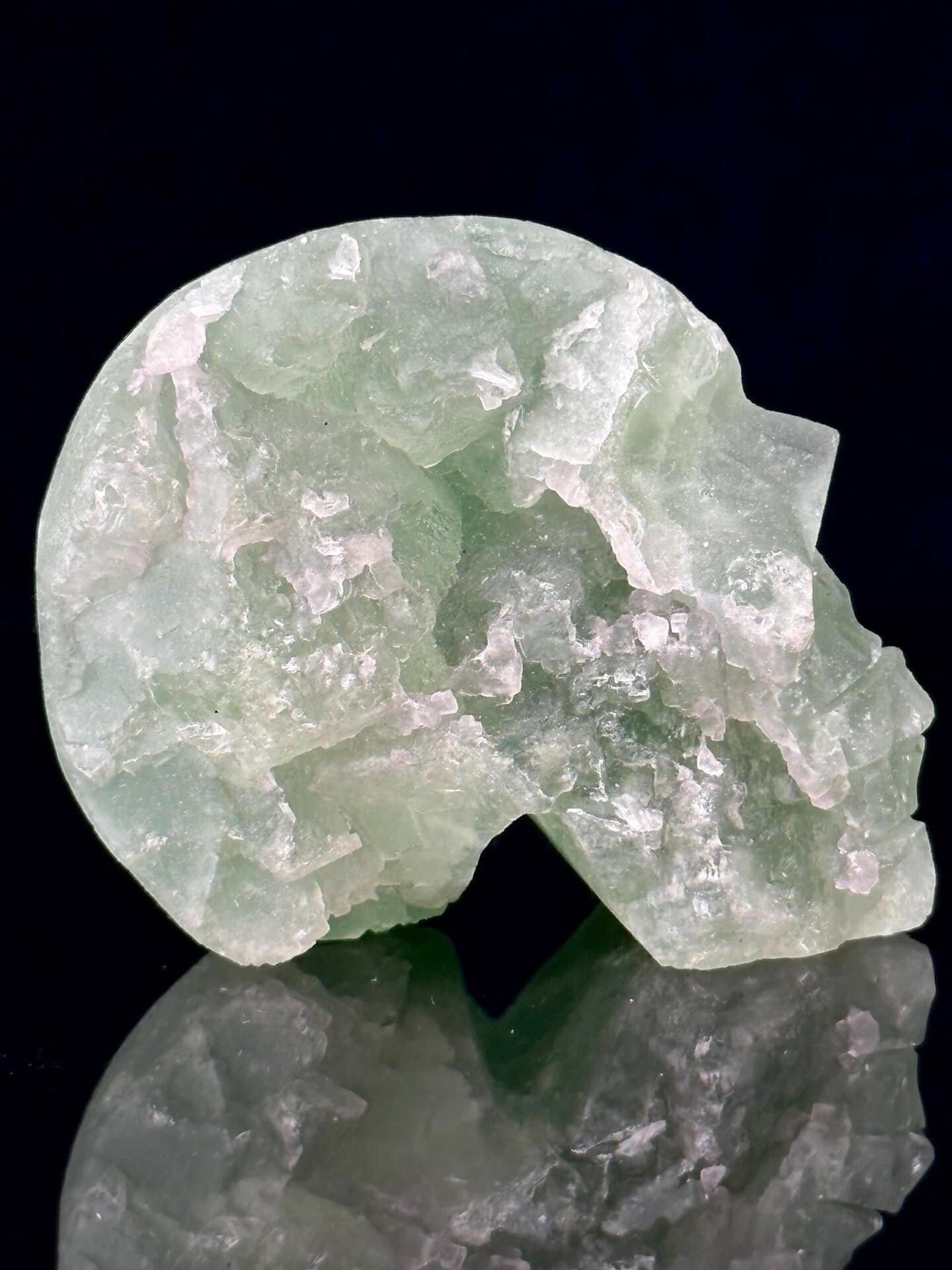 Angled view showing fluorite skull geode and interior
