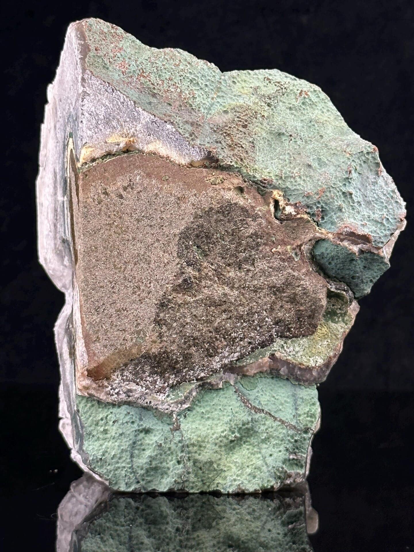 Back view of quartz geode skull with malachite accents