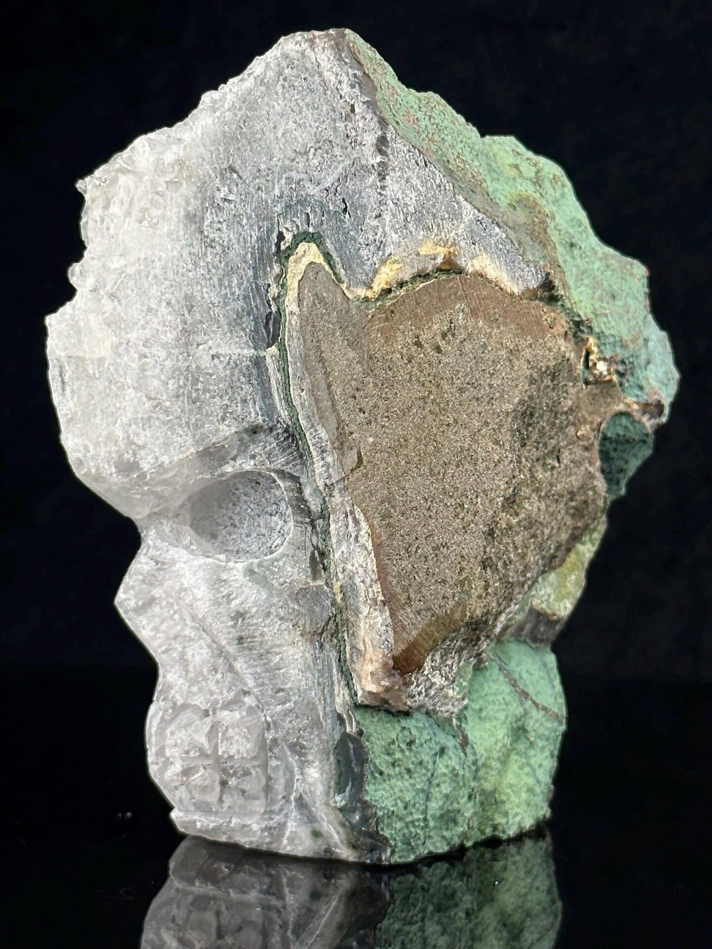Detail of malachite green inlay on quartz crystal skull