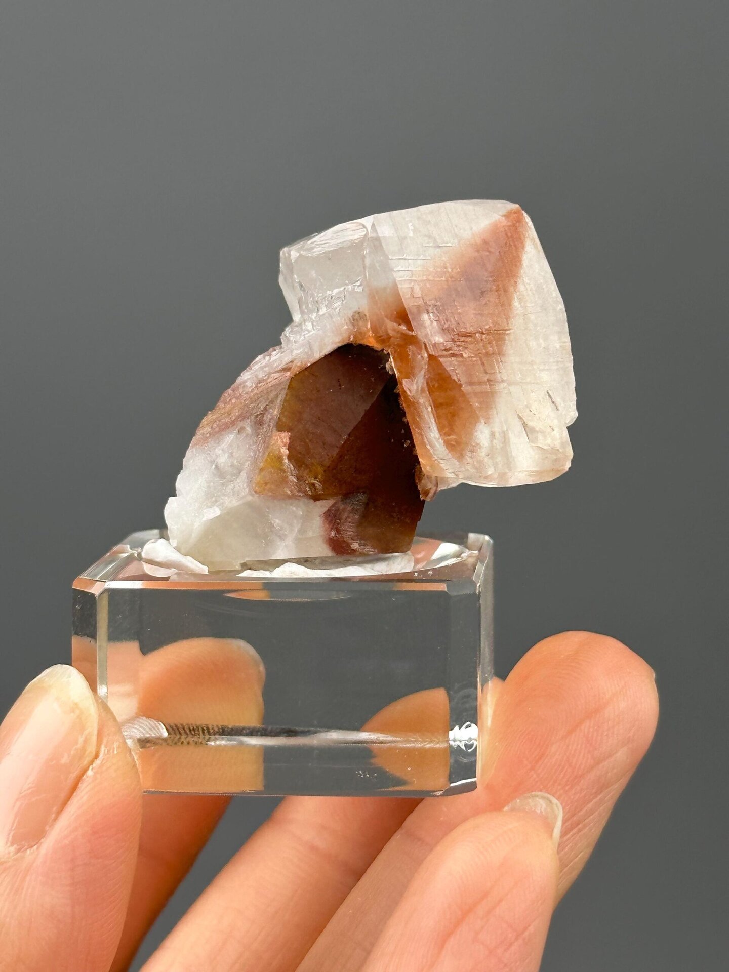 Front view of calcite showing vivid red hematite inclusions
