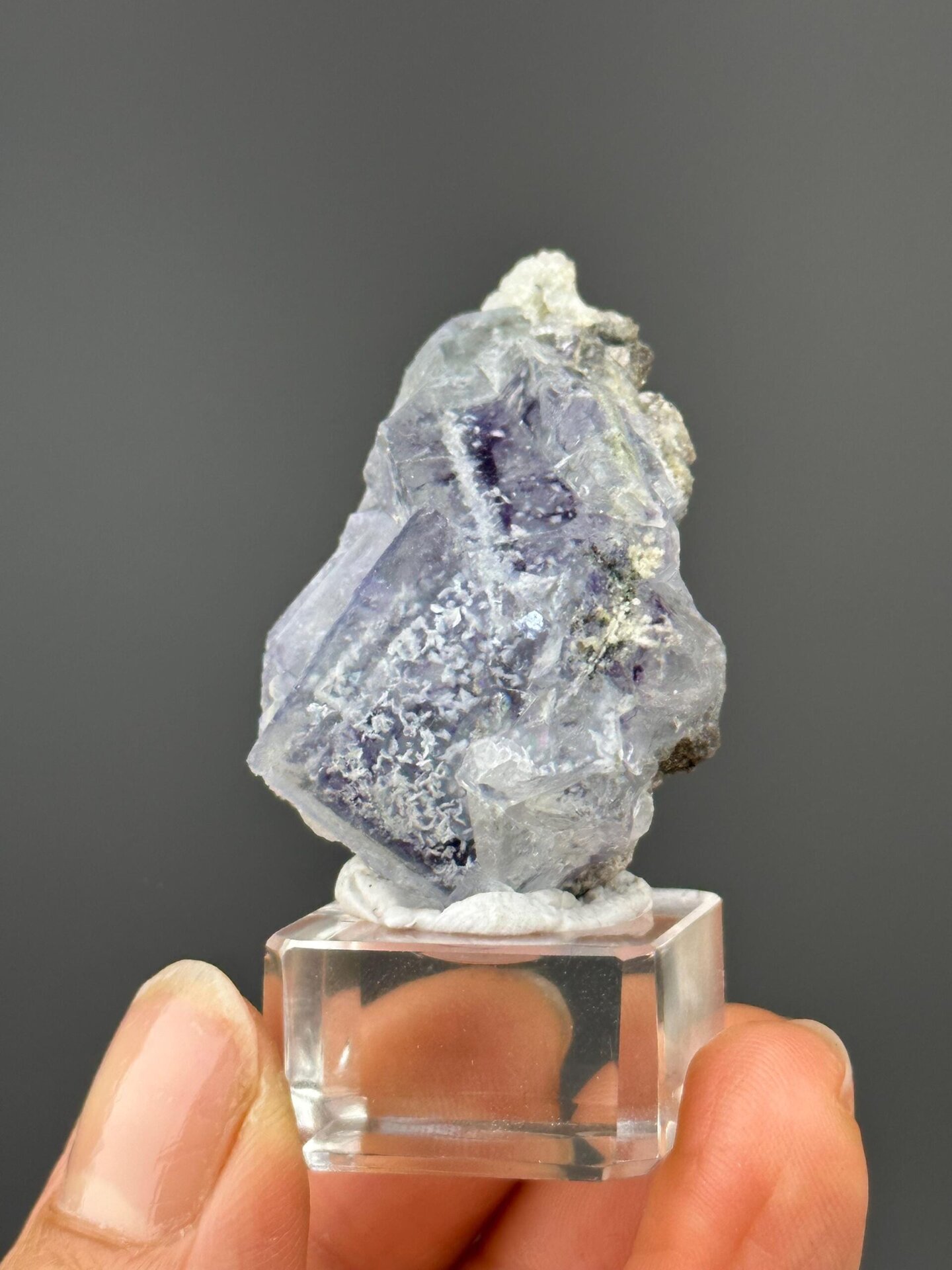 Angled view highlighting phantom bands in purple fluorite