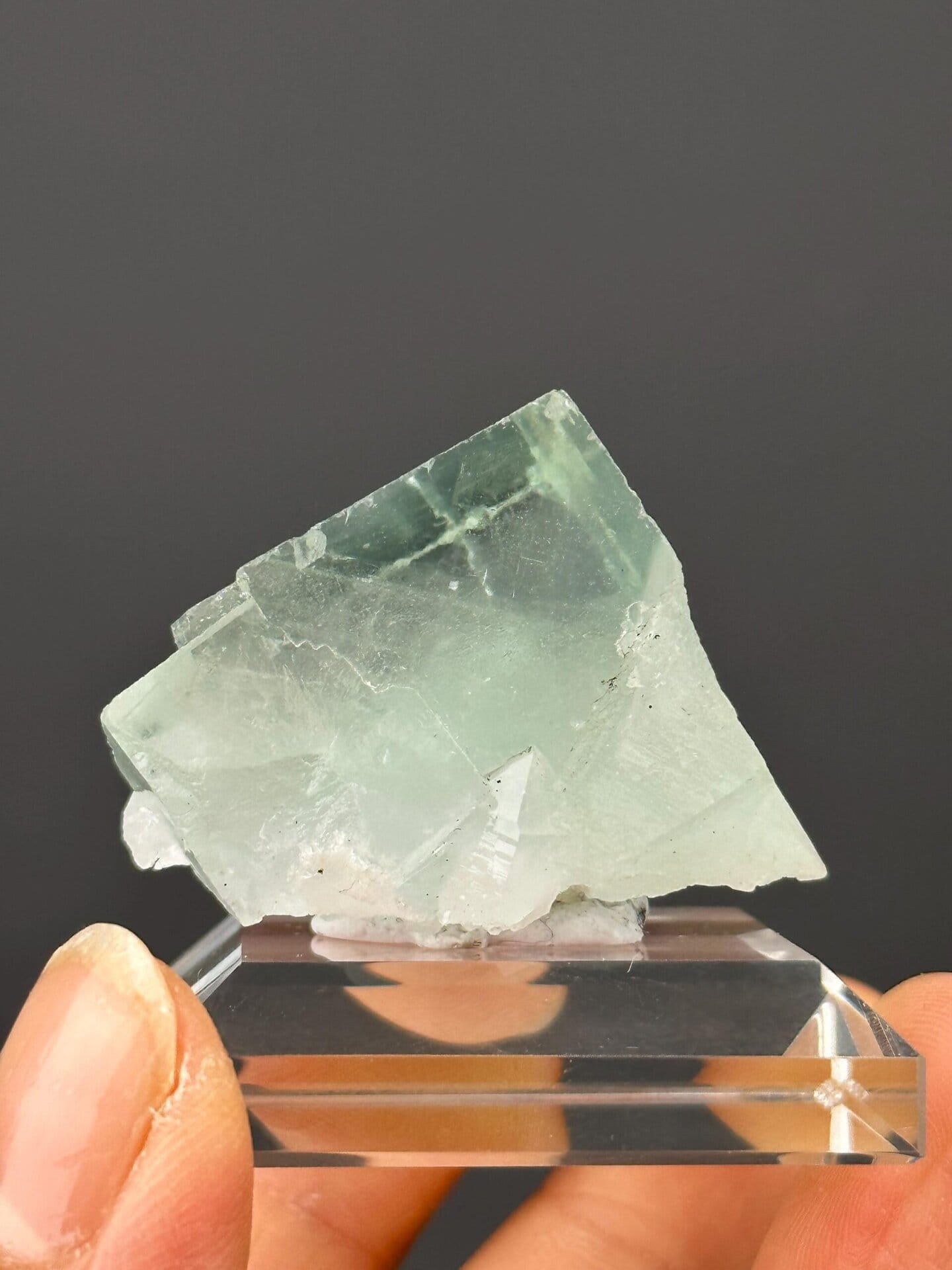 Angled view of green fluorite cluster highlighting transparency