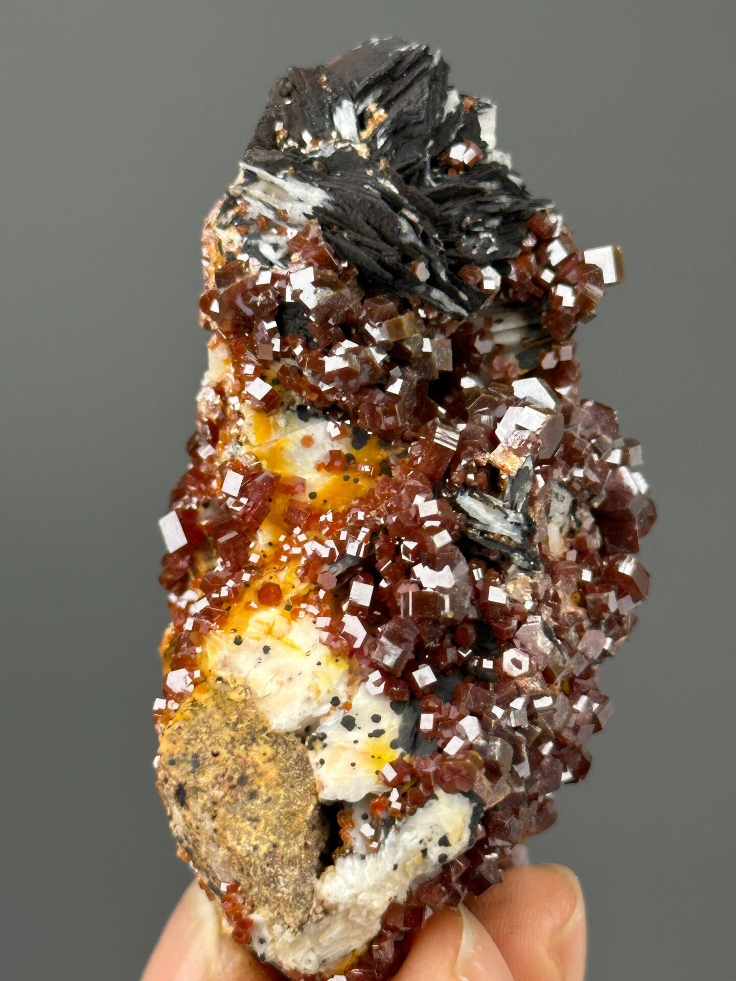 Angled view highlighting red vanadinite crystal formation