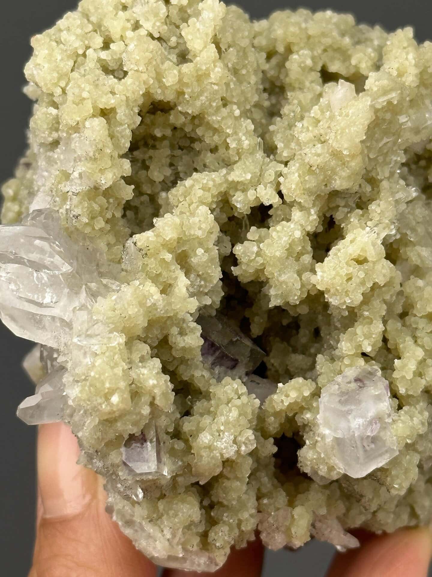 Close-up of green fluorite crystals showing vitreous luster